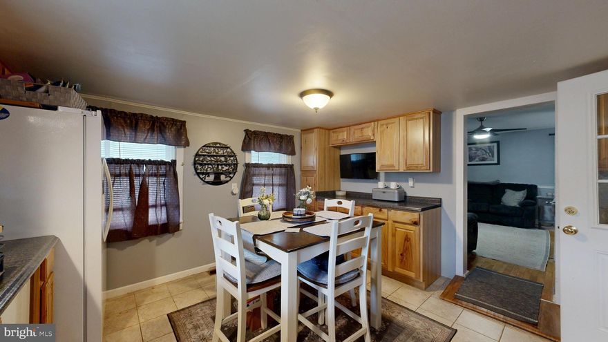 With no association fees or restrictive guidelines you have the freedom to personalize your living area.  The town of Magnolia allows you to have a small home business if you choose.  The property boasts a detached 2 car garage, offering not only secure parking but additional storage space.  Step inside to discover a residence that has been meticulously maintained, showcasing its very good condition.  The neighborhood is rich with a lifestyle that balances tranquility and accessibilities to nearby amenities.1700 square feet living space

On the first floor, where you’ll find a warm and inviting eat-in kitchen, a spacious living room, two bedrooms, a full bath with a stall shower, and a convenient mudroom/laundry area with direct access to the cellar. Upstairs, the second floor features three additional bedrooms and a second full bathroom with a stall shower, providing plenty of space for family, guests, or a home office setup.Additional interior highlights include: Unfinished attic with pull-down stair access, hardwood flooring, and spray insulation—ideal for storage or future expansion, unfinished cellar accessible through the laundry room. Outside, enjoy a detached two-car garage plus off-street parking for 2–3 vehicles, a partially fenced yard with 6-foot wood privacy fencing, along with a separate fully fenced 3-foot section—perfect for pets or gardening. Major updates & features include: leased solar panels installed in 2017, full plumbing upgrade & new hot water heater in 2020, electrical upgrade to 200 amp service with new breaker, all receptacles, switches, and faceplates replaced in 2022, along with a new heat pump for central heating & air conditioning (both floors) also in 2022, and in 2024, a new water treatment system was installed. All appliances stay, making this home truly move-in ready: electric stove, over-the-range microwave, Maytag commercial washer & dryer (serviced in 2024,) Asko dishwasher (serviced in 2024,) and Frigidaire side-by-side refrigerator (new in 2024.)