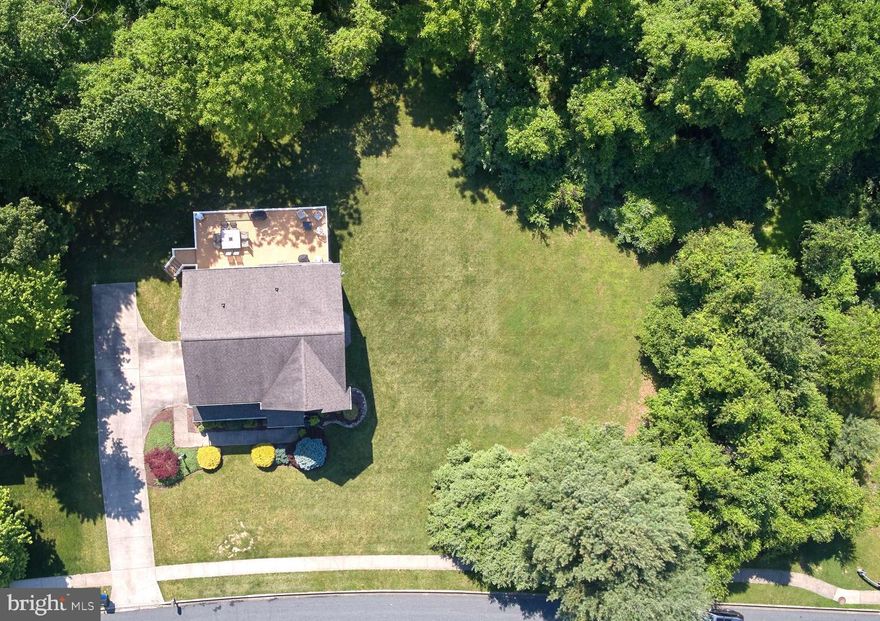 ONE OF THE BEST LOTS IN FOREST LAKES JUST BECAME AVAILABLE! You Will Be the Envy of the Neighborhood! Great Corner Loc., Backs to Trees, Open Views from the Front Porch w/Open Community Space to the Right of the Property Providing a Wealth of Entertaining Space for You & Your Family to Enjoy! This Stunning 4 Bdrm / 3.5 Bath Partial Stone Front Colonial w/3 Fully Fin. Lvls Offers Over 3,000+ Fin.Sq.Ft. The Lush Landscaping & Striking Red Door is Sure to Catch Your Eye as You Pull in to the Priv. Drive w/2 Car Side Load Garage. The Grand Two-Story Foyer w/Balcony Overlook Opens to the Spac. Liv. Rm & Formal Din. Rm. w/Lrg Bay Window, Decorative Column Accents & Custom Moldings. Gorgeous Wide Plank Hand Scraped Hdwd Flrs & 9' Ceilings Run Thruout the Main Lvl. Enjoy Relaxing w/Family & Entertaining Friends in the Beautifully Appointed Fam. Rm w/Gas Fireplace that Leads to the Stunning Remodeled Designer Eat-In Kit., Every Chef's Dream! Featuring Custom 42" White Cab. w/Under Cab. Lighting, Granite Counters, Lrg Ctr Island w/Barstool Seating, SS Appl., Custom Range Hood, Uniquely Designed Coffee Bar, Recessed & Pendant Lighting, Custom Subway Tile Backsplash & Great Table Space, All Appl. Convey. Carry the Entertainment Outdoors to the Expansive 36' x 16' Trex Deck w/Vinyl Railings & Stairs that Lead to the Gorgeous Outdoor Oasis, Feels Like Your Own Priv. Sanctuary! This 0.37 Acre Lot Backs to Trees, Leads to a Stream & Adjoins Open Community Space Expanding Your Outdoor Pleasure! The Fully Remodeled Half Bath & 2 Car Garage w/Built-in Workbench Complete the Main Lvl. The Upper Lvl Grand Mstr Suite w/Cathedral Ceiling, Designer Molding, Lrg Walk-In Closet (8'x7') & Attached Spa-Like Mstr Bath w/Ceramic Tile Flrs, Double Vanity, Soaking Tub, Sep. Shower, Recessed Lights, Upgraded Fixtures & Lighting & Built-In Magazine Rack is Sure to Impress! 3 Add'l Generous Size Bdrms, All w/Great Closet Space, Full Hall Bath w/Double Vanity, Tub/Shower Combo. & Ceramic Tile Flrs & Sep. Laundry Rm Rounds Out the Upper Lvl, Washer/Dryer Convey. The Fully Fin. Walk-Out Lwr Lvl Offers an Enormous Rec Rm/Play Rm/Game Rm w/Sep. Office/Possible 5th Bdrm & Attached Full Bath w/Tub/Shower Combo. & Amazing Closet Space, Great In-Law Suite Potential. An Overwhelming Amount Of Storage is Provided in the Unfin. Storage/Workshop/Utility Rm w/Add'l Secure Storage Just Outside the Sliding Doors. THIS IS ONE YOU DON'T WANT TO MISS! Shows Pride of Ownership, Original Owners, May Never Be Available Again! Great Harford County Schools! Walking Distance to Forest Lakes Elementary, Dunkin Donuts, Chick-Fil-A, Kohls, Starbucks, Chipotle & More. Easy Access to Downtown Bel Air, APG, MD-24, US-1, MD-543, Rt 22 and I-95. Updates Include; New Sliding Doors on Main Lvl (20'), Remodeled Kit. (15'), Hdwd Installed Thruout Main Lvl (15'), New Smoke/CO Detectors Thruout (15'), Remodeled Main Lvl Powder Rm (14'), Redesigned Front Entrance, Installed Front Porch (13'), Trex Deck w/Vinyl Rails (07'), Finished Lwr Lvl (04') & the List Goes On... SCHEDULE TODAY BEFORE IT'S GONE!