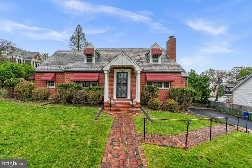 Welcome to 2605 Queen Anne Rd, a beautifully maintained all-brick home that seamlessly blends classic charm with thoughtful modern updates. Hardwood floors flow throughout the main living spaces, complemented by an updated kitchen featuring stainless steel appliances and a layout designed for both everyday living and entertaining. The home offers exceptional flexibility with two primary suites—each with updated bathrooms—perfect for multigenerational living or added privacy.

The finished lower level presents a unique opportunity with its own kitchenette, spacious rec room, full bathroom, and private side entrance, making it ideal for guests, an in-law suite, or potential income-producing use. A versatile library/office with built-ins and knotty pine walls can easily function as an additional bedroom. Modern conveniences include WiFi-enabled heating and air, remote-controlled lighting in the upper bedroom, and Ring security systems on all doors.

Outdoor living is just as inviting, with a covered patio off the first-floor bedroom, a rear gardening area, and a concrete patio perfect for relaxing or entertaining. Complete with a one-car garage and an expansive driveway, this home offers both comfort and functionality in a highly desirable setting.