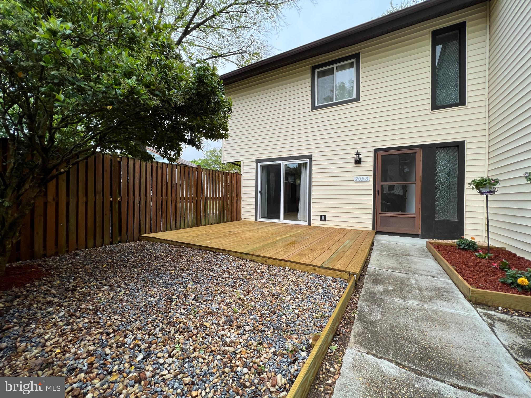 Don't miss out on this unit! Rare opportunity to have an end unit with direct access to your garage. Home is updated throughout offering spacious living. Updated kitchen with plenty of counter space. Slider to new deck for entertaining or just to relax in privacy. Lawncare is included for exterior of unit :) Show and sell today!