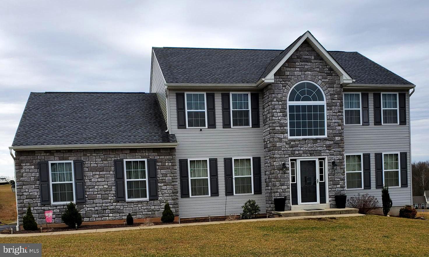 This is the one you have been waiting for in the Woods Edge Community! The Celia model has a desirable, modern open floor plan. The front exterior has visual appeal with the stone facade. Upon entering you will feel the openness  and you'll notice the formal living room and dining room. Large closet in foyer area. The large family room is open to the kitchen that is sure to meet today's lifestyle. Just off the kitchen and breakfast area you will find a butlers pantry that boasts a built-in wine rack and wet bar. The side entrance is convenient to the powder room and laundry area as well as another large coat closet. Nothing like coming home and having your own private retreat in the master suite.  Complete with a sitting room and master bath. Melt the stress away in the soaking tub in your master bath.  And if all this isn't enough there is MORE in the fully finished basement. You will be delighted to find a modern full kitchen and entertainment area. This all is accompanied with a full bath, laundry area and 2 finished 15x15 rooms. You will be pleased to know it has a separate entrance as well. The daylight basement has a bright and airy atmosphere. This home will not last long. Don't wait. Schedule your private tour, today!