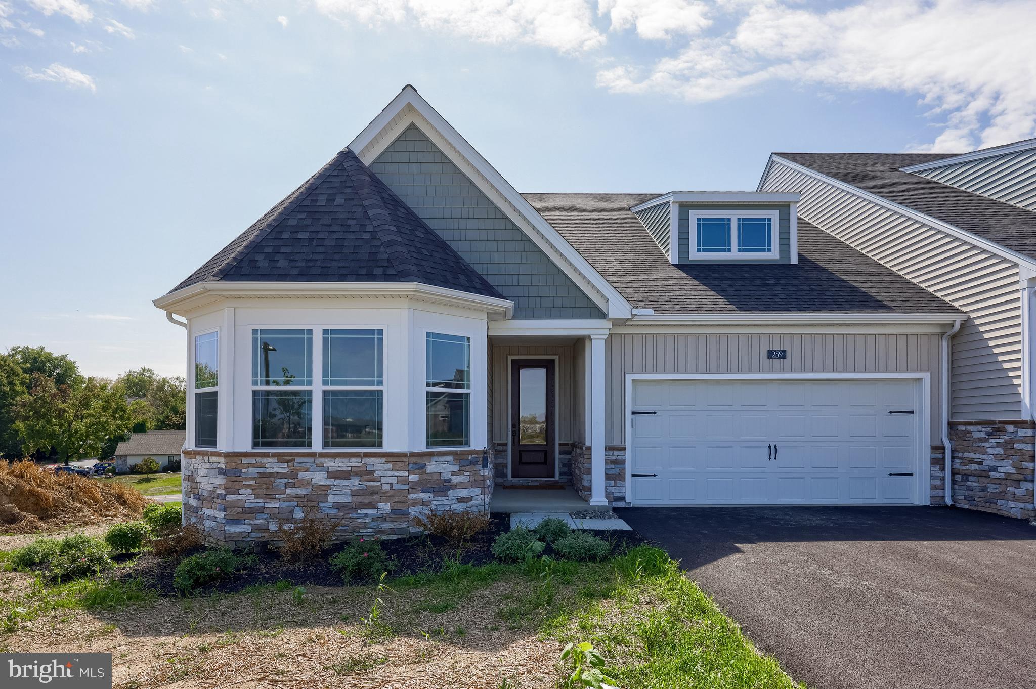 Welcome to the new Bellaride section of Crossgates in Millersville, where comfort, convenience, and style come together in this beautifully designed ranch home. Offering over 1,800 square feet of thoughtfully planned living space, this semi-detached home is perfect for those seeking the ease of main-floor living without sacrificing elegance or functionality.
The open floor plan flows seamlessly from the kitchen, featuring an island, stainless steel appliances, quartz countertops, and a ceramic tile backsplash, into the eat-in area and formal dining room—ideal for both casual meals and special gatherings. The great room, with its warm gas fireplace, invites you to relax or entertain with ease. A spacious primary suite includes a luxurious bath with ceramic tile flooring, quartz countertops, and a walk-in ceramic tile shower. Two additional bedrooms and a full bath provide space for guests or a hobby room.
Enjoy the daylight walk-out basement that offers endless possibilities for storage or future finishing, as well as the elevated covered deck with views of the open common areas—perfect for quiet mornings or evenings outdoors. Additional highlights include luxury vinyl plank flooring, gas heating and cooking, and a two-car garage.
Bellaride at Crossgates is designed for a low-maintenance lifestyle, with the HOA taking care of snow removal and lawn care so you can spend more time doing what you love. The community offers walking paths, a ball field, and tennis courts, creating a welcoming environment to stay active and connected. All of this is set in a prime Millersville location, close to shopping, schools, and just minutes from downtown Lancaster.