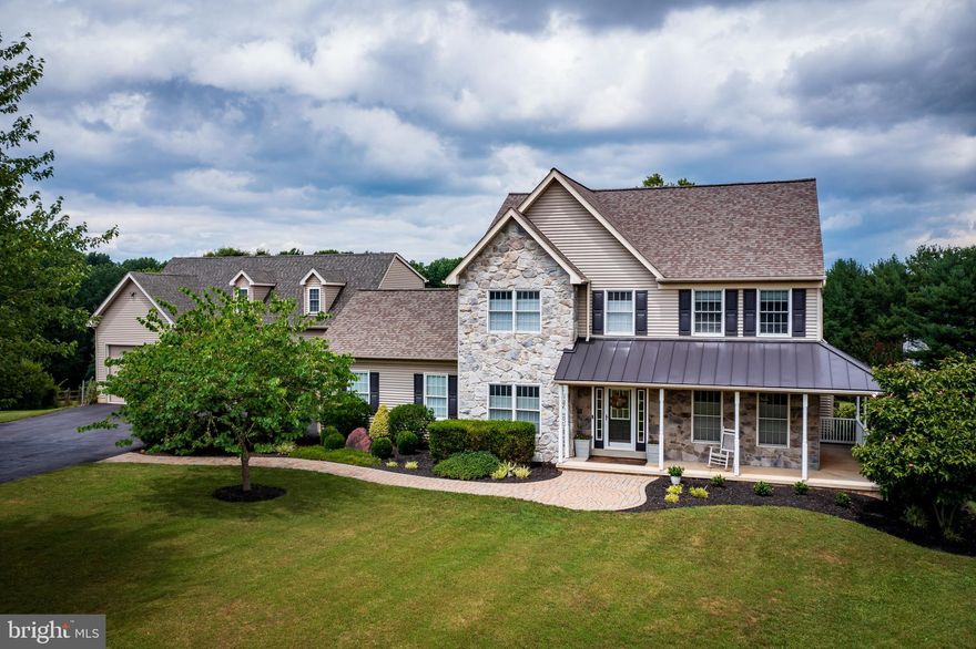 Picture perfect property situated on 2+ acres at the end of a cul de sac in coveted Holbrook Heights. Well crafted and enormous garage addition with loft area and large workshop. 5 garage spaces! Beautifully updated kitchen and bathrooms. 4 bedrooms, 2 full baths, 2 half baths, finished walk out basement, stunning kitchen with natural stone countertops, tiled backsplash and center island, custom built-ins and details on all levels with great attention to detail throughout! Urbana High School district. Excellent location!