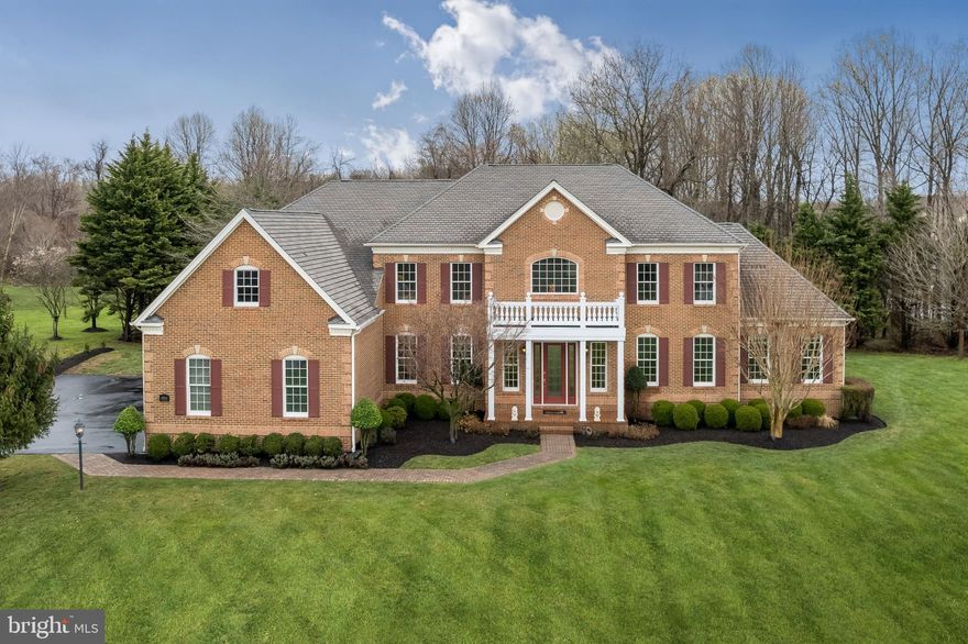 Supremely gorgeous custom built Toll Brothers estate located in the coveted Homewood Crossing community, pristinely maintained by the original owners. Offering one of the best lots available in Howard County showcasing a remarkable portico entry, professionally landscaped grounds, exquisite exterior lighting, and a preservation land view! Embellished with a beautiful grand two story foyer; featuring a dual curved staircase. Opposing formal living and dining rooms complemented with intricate molding, trim, and light filled windows. Sensational great room graced with a soaring coffered ceiling, floor to ceiling windows, and a gas burning fireplace. Prepare chef inspired meals in the custom kitchen offering modern elegance yet comfort and style with sleek granite counters, professional grade Monogram appliances, gas cooking, center island with seating, wet bar, display cabinetry, pantry, pendant lighting, a casual dining area, and an adjacent breakfast room perfect for enjoying your morning tea. An expansive sunroom provides an ideal space for relaxation. A welcoming 1st floor bedroom boasts a dual entry bath, ideal for the in laws or visiting guests; a laundry room; and an arrival center conclude the main level. Travel up the rear stairs to the magnificent primary bedroom suite highlighted with a tray ceiling, separate sitting area, and a walk-in closet. Beautiful primary bath offers separate vanities, Jacuzzi, oversized shower with seating, two water closets, and an additional huge walk-in closet. Three additional graciously sized en suite bedrooms complete the upper level sleeping quarters. Truly impressive lower level embellished with a recreation room, custom bar, media room, exercise room, sixth bedroom, bonus room, full bath, additional storage, and walkout level access. Enjoy the evening breeze from the comfort of the lovely Flagstone patio overlooking mature trees and a preservation land view. Absolutely perfect a must see!