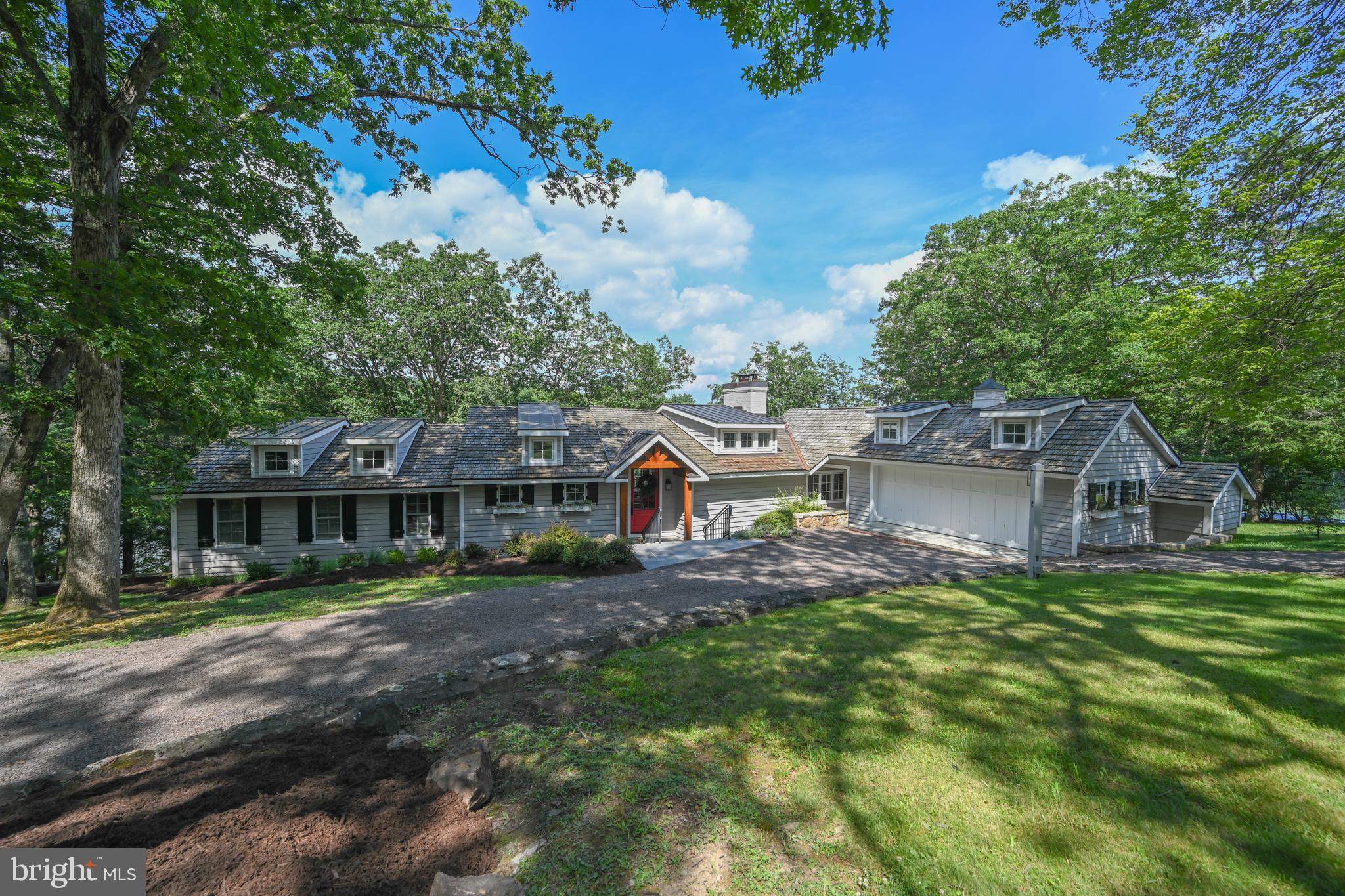 A one of a kind lakefront retreat overlooking a beautiful cove in the peaceful Pergin Farm community at Deep Creek Lake. Situated at the end of a quiet lane, the completely updated 5 bedroom 4.5 bath cottage style home also offers a separate 2 bedroom 2 bath guest dwelling, two individual dock sites and a beautiful tennis facility. With 2.15 acres+- and 400' of prime lake frontage at the end of a private lane, peace and privacy is yours.
The impressive cottage style residence offers an inviting main level living area with a fabulous kitchen, beautiful wood burning fireplace, 3 suites and direct access to an expansive deck with a hot tub that has been built into the deck surface. The lower level offers two additional suites and a relaxing lakeside family room.
The completely renovated guest cottage is the perfect compliment to the main residence. The open great room offers a spacious living room with cathedral ceiling and fireplace. The attached kitchen is just the right size and includes a pantry and breakfast bar. The eating area adjoins both spaces and overlooks the lake. Two suites with easy bath access are added features.
The guest cottage offers direct access to the tennis court area offers direct deck and hot tub access. It also offers enough space to be modified for many uses including pickleball, basketball and or just about any other outdoor activity you can imagine.
A complete listing of all the property upgrades is available in the property document section.
The subject property was considered one of the best spots in Pergin Farm when it was developed by Perry and Virginia Smith approximately 50 years ago. Perry and his wife carefully developed Pergin Farm with a commitment to limiting development and protecting the natural beauty the area offered. The majority of the homesites created are larger than most of the lots created in other sections of the lake. Perry's daughter Randee and her husband Mark have continued protecting Pergin Farm from over development with their responsible stewardship of the remaining lands that they continue to hold.
Not long ago, the Pergin Farm homeowners modified the subdivision to end short term vacation rentals adding to the attraction of the community. More recently high speed internet was brought to the community. The roads within the subdivision have remained private and offer the ideal environment for walking biking or even hiking.