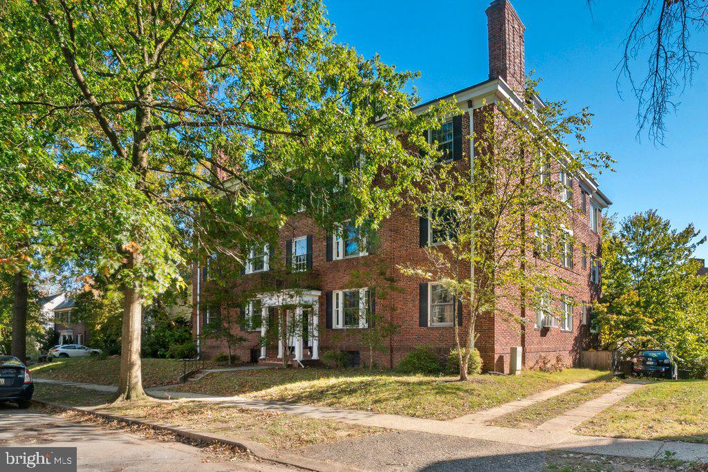 Nestled in a grand old brick building near Johns Hopkins University and Roland Park, this delightful third-story condo is brimming with charm and abundant natural light. The classic floor plan features a spacious dining room that flows seamlessly into a large living room with a cozy fireplace and built-in bookshelves, creating a warm and inviting atmosphere. Beautiful hardwood floors extend throughout the condo, adding timeless appeal. The home offers two generously sized bedrooms and a well-proportioned bath. A highlight of this condo is the stunning back sunroom, drenched in sunlight from every window—perfect for relaxation or entertaining. The galley-style kitchen offers potential for upgrades, making it a wonderful opportunity to customize. This charming one-floor condo won't be on the market for long! (See condo docs, bylaws & rules and regs attached to listing.)