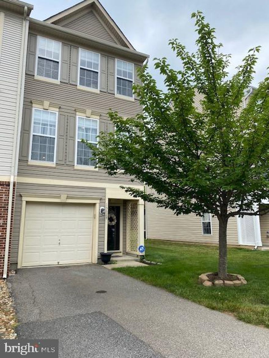 Beautifully Staged 3 Level Townhouse End Unit with Garage, 3 Bedrooms, and 3.5 Baths.  The walk-in level has a bedroom with a full bath, spacious closet, and a walk-out patio fully fenced.  The kitchen is bright & airy complementing the open floor plan and opening to a deck off the rear. The open kitchen features hardwood floors, granite countertops, stainless steel appliances, and gas cooking. Beautiful View from the deck and a great place to have your morning coffee.  The upper level has two bedrooms with their own private bathrooms, and a convenient laundry in the hallway. The furniture in the unit will be moved out when a lease is secured. The driveway is long enough to hold two cars. Lawn care, trash, community amenities: pool and fitness center are all covered in the rent! This location is also a commuter's dream with quick access to Stonebridge Potomac Town Center and Potomac Mills, I-95, VRE, Quantico, and Ft Belvoir!