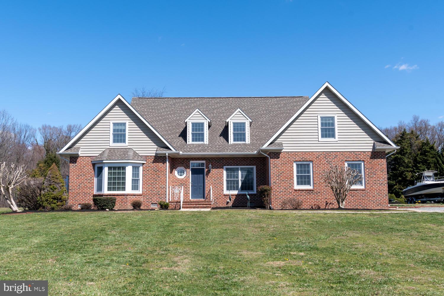 This home has so much to offer and located in a quiet/relaxed cul de sac on just under 2 acres! Five large bedrooms, 3 1/2 bathrooms including TWO bedrooms being primary bedrooms, one upstairs and one on the main level. Open floorplan design with beautiful hardwood flooring, cathedral ceilings, formal dining area, and large kitchen with gas cooking. First floor primary bedroom has a private walk out patio and a beautiful clawfoot tub. Large walk in closets in every bedroom, separate laundry area off of the two car garage, and many storage closets. Built with 2x6 lumber and has had many upgrades made. New roof and furnace. This is a very efficient home; this family uses about 800 gallons of propane a year and electric runs about $125 a month. Be sure to check this one out quickly before it's gone! More pictures coming soon