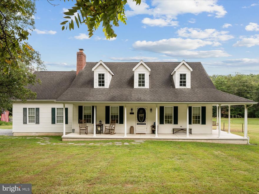 Offer Deadline 8/31/2025  at 2:00pm    Own your own farmette with this 4-bedroom, 3-bath home combining country charm and modern style. Situated on 3.61 acres of flat, usable land the outside can’t be beat.  The property backs to a beautiful creek, offers trails for exploring, abundant storage, and NO HOA. Outdoor features include a wrap-around porch ideal for morning coffee, a spacious rear deck for entertaining, a large barn with electric,  garden boxes,  rear fencing, chicken coop with run-in, a climate-controlled 2-car garage for comfort, and an additional shed with electric. Inside, you'll find an open-concept kitchen with new quartz countertops, a main-level primary suite with walk-in closet and private bath, a spacious living room, hardwood floors throughout, a mudroom with laundry, and a half bath for guests. Upstairs there are three generously sized bedrooms and another full bath.  With room for animals and a location just 20 minutes from the hospital, shopping, and dining, this property is ready to bring your country dreams to life. No dirt roads. Bring your animals