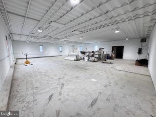 Exceptional warehouse/manufacturing facility. Well maintained with approximately 5500 sq ft both on the main level and lower level for a combined 11000 sq ft in the building. Loading dock with door, requires ramp. Potential for front office area as well bathroom facilities. Ample off street parking with private lot.