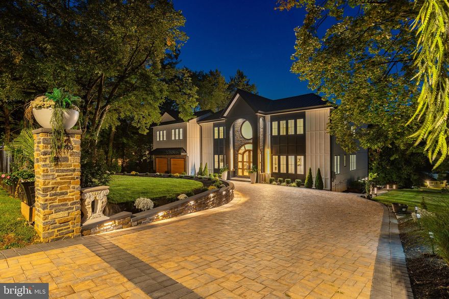 Enter into a world where soaring design, sweeping Arboretum views, and one of the largest backyard deck's in Chestnut Hill converge to create a once in a lifetime new construction home, crafted for today’s sophisticated buyer with room for your personal signature. A long illuminated paver driveway framed by automatic smart gates creates a dramatic approach with generous space between neighboring homes and a backdrop of lush greenery, offering a rare sense of privacy and arrival. Inside, soaring 10 foot coffered ceilings, oversized doors and tall glass windows flood the interiors with natural light, while 10 inch wide plank character white oak floors, a sleek glass-railed illuminated staircase, and gallery-like sightlines create an unmistakable sense of modern sophistication. The chef’s kitchen and living spaces flow seamlessly to an expansive 2,000-plus-square-foot Zuri backyard deck, perfect for year round entertaining and taking in the treetop views. Four ensuite bedrooms and a versatile office or library offer private retreats, while the lavish primary suite impresses with a 16 foot cathedral ceiling, spa-inspired bath with dual glass showers, soaking tub, sauna, four skylights, and dual custom closets. The finished 1,700-square-foot lower level offers endless potential including the option for a guest suite or additional living space. Completing this remarkable home is a two-car garage with custom hardwood doors, smart openers, soaring 12-foot ceilings and its own mini-split system for climate control. Built with premium Hardy fiber cement siding and a standing seam metal roof engineered for UV reflection, this home delivers lasting durability, efficiency, and a lifestyle of unmatched privacy and prestige in one of Philadelphia’s most sought-after neighborhoods, offering the rare chance to own a Chestnut Hill masterpiece before it’s fully completed with your personal touches.