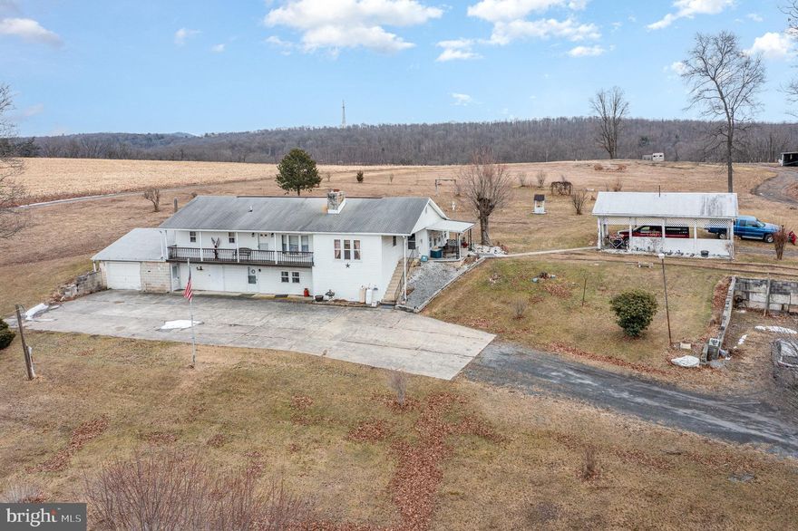 Enjoy the amazing views of the valley from this raised rancher on 4.5 acres. Features 3 bedrooms, family room, dining room and eat-in-kitchen with wrap around enclosed porch. Finished lower level with fireplace. Shed and outbuildings and conveniently located within  minutes from 322!