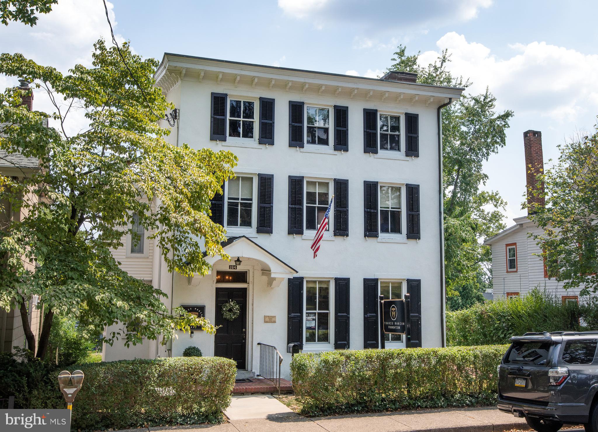 A historic Borough gem, this classic circa 1869 building offers the rare opportunity to build out your dream downtown residence. Join the neighboring boom in multi-million dollar new construction and renovate/expand this three story building on a large lot, complete with a right of way driveway and detached garage. The perfect blank canvas awaits: high ceilings on the main level (approximately 9'), oversized Victorian/Federalist era windows, all just steps from the heart of downtown Doylestown. Create your walk-to-everything lifestyle, adjacent to excellent supporting real estate. This property has been used commercially for decades, and is zoned for either commercial or residential use, and does not currently have a full kitchen or full bathrooms. Residential conversion offers an opportunity to make it exactly as you'd like!