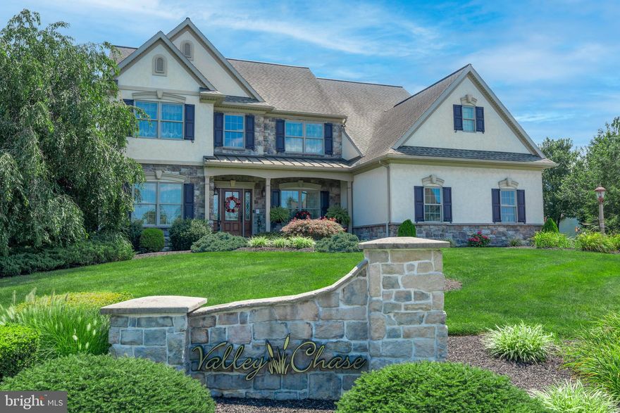 Welcome to this beautifully designed 4-bedroom, 2.5-bathroom home in Cornwall-Lebanon School District! Sitting on a spacious corner lot in the Valley Chase neighborhood, this home impresses with gorgeous stone and stucco siding and elegant interior touches, including abundant crown molding throughout and low-voltage windowsill candles. Enjoy the freedom of homeownership with no HOA restrictions or dues. Step inside to a grand 2-story foyer, where hardwood floors and an ornate chandelier create an inviting entrance. The adjacent living room offers a bright and airy retreat, while the formal dining room showcases refined details such as wainscoting, chair rails, and a tray ceiling. The eat-in kitchen is a chef’s delight, featuring granite countertops, stainless steel appliances, electric cooking, a center island, and a breakfast nook with sliding doors leading to the patio. Soaring ceilings, large arched windows, and a cozy gas fireplace define the spacious family room, perfect for gatherings. A home office with stylish built-ins and a convenient powder room complete the main floor. Upstairs, the luxurious primary suite is a true retreat, boasting a tray ceiling and a double-sided gas fireplace that leads into the private spa-like ensuite with a jetted tub, walk-in shower, and a spacious walk-in closet. Three additional bedrooms with plush carpeting and a full bathroom with a tub shower complete this level. The finished basement recreation room provides extra flexibility, ideal for movie or game nights with family and friends. Outside, enjoy a private backyard oasis with a cozy gazebo and patio, perfect for relaxing or entertaining. Cleaning is a breeze with a whole-home central vacuum. An oversized 3-car attached garage offers ample storage space, and outdoor hard-wired front spotlights provide visibility after dusk. Don't miss this incredible opportunity—schedule your showing today!