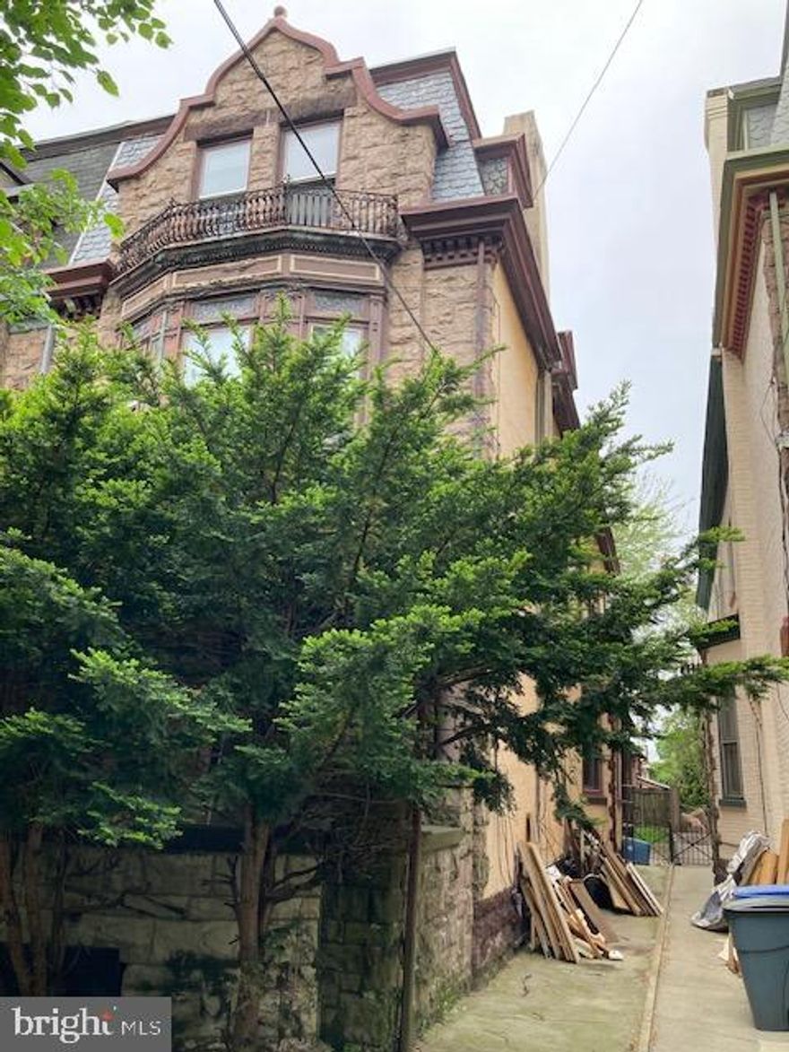 3 unit twin home in need of major rehab. This building is in the Centre Park historic district. Being sold as is