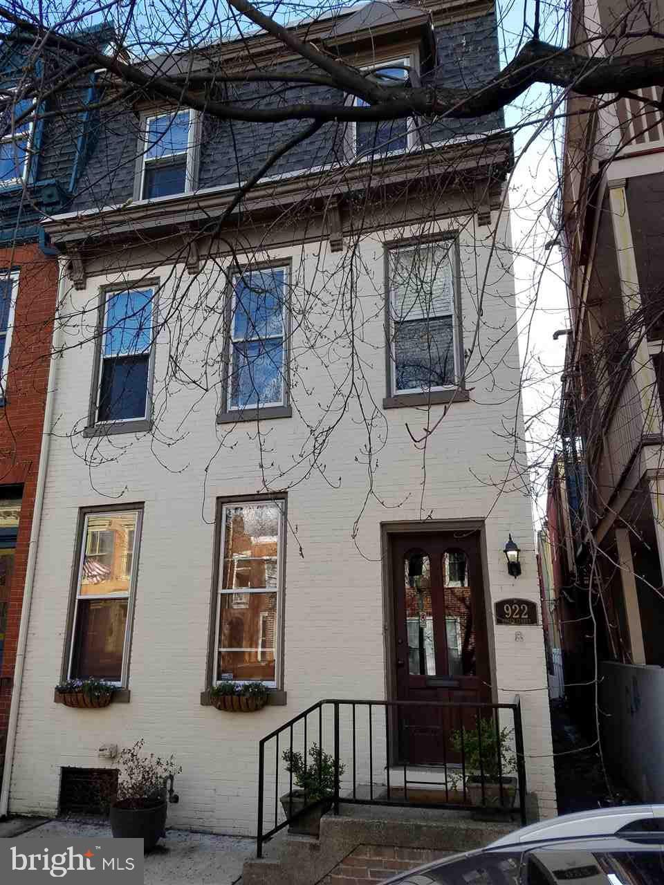 Handsome brick end-of-row home in sought-after Midtown just 3 blocks to Capitol Complex! Wood floors in living/dining rooms. Large remodeled eat-in kitchen w/lots of work & storage space. Half bath w/ laundry on 1st floor. Spacious master bedroom w/ walk-in closet and adj. den/office. 3rd floor bedroom suite too! Fenced courtyard w/ brick patio. Just a few blocks to Market, Millworks, Cinema, Downtown. Not in 100 year flood plain!