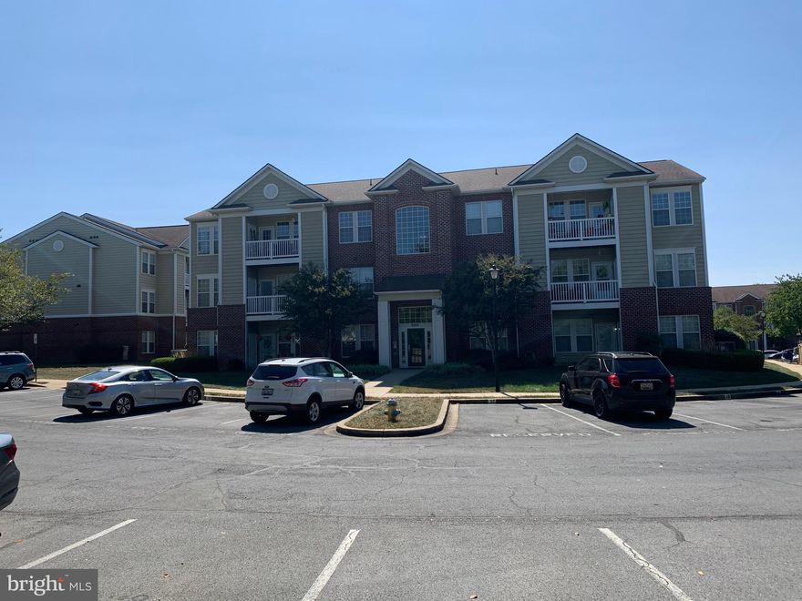 Deluxe first level 2 bedroom, 1 full bath,  1 1/2 bath  with extensive updates. Completely remodeled kitchen and baths. Neutral paint throughout. Laminate flooring with ceramic tile kitchen floor. the unit is located on the back of the building overlooking the commom area with a covered pourch/patio.