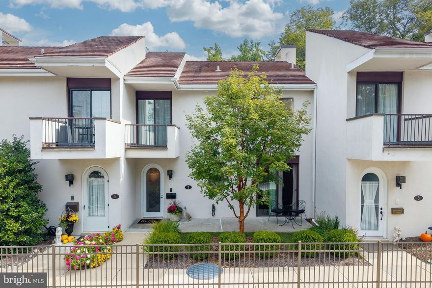 Charming and architecturally distinctive, this 2 Bedroom, 2.5 Bath townhome is located in one of Devon's most desirable gated communities. Designed with French-village flair, it features an open floor plan with parquet flooring that stretches from the entrance area through to the stairs leading down to the lower level. You'll love the modern kitchen and the dining area that opens onto a private front patio - perfect for morning coffee or entertaining. The spacious living room features a curved fireplace and sliding glass doors that open onto a very private, dramatic patio, offering seamless indoor-outdoor living surrounded by beautifully landscaped grounds. Floating staircases add a contemporary touch throughout and carry you up to the 2nd level where both the main bedroom and guest bedroom have private bathrooms as well as balconies, bringing in natural light and garden views. A soaring, vaulted ceiling in the Guest Bedroom creates a sense of openness and gives this room a charming atmosphere. With 9' ceilings in the Main bedroom, the room feels airy and expansive, providing ample space for both a restful sleep and a cozy area to sit and read a book. The lower level of this townhouse off e rs a versatile family room, perfect for gatherings or relaxation or just watching your favorite TV show. Adjacent to this room you'll find a storage room with plenty of shelving for all your needs, plus a convenient washer and dryer. There's also another multi-purpose room with brand-new, vinyl plank flooring, offering easy access to the underground parking garage. Parking is a breeze with 2 dedicated underground spaces offering direct access to the home, plus additional open parking to the right and left of the front entrance, perfect for guests or extra vehicles.