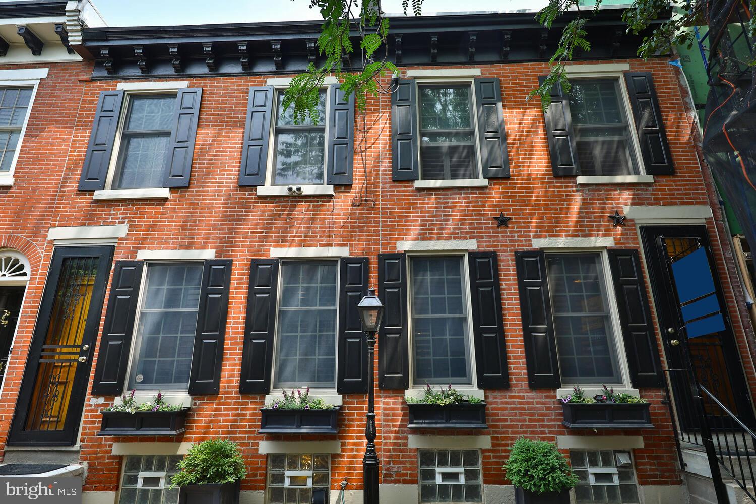 Welcome to this unique and stunning double-row home located in the highly sought-after Fairmount neighborhood of Philadelphia. This home boasts a prime location on a picturesque tree-lined street, providing a serene and peaceful ambiance. Within walking distance to the Art Museum, Fairmount Park, and Center City, this property offers convenience and accessibility to some of Philadelphia's best attractions.
As you enter the home, you will be greeted by the open and airy living room, featuring fabulous wide planked oak floors and an abundance of natural light. The high-end stainless-steel kitchen appliances, including a Sub-Zero fridge and Wolf gas oven, along with sleek soapstone countertops and custom-designed butcher block island top, make the kitchen a chef's dream. The kitchen overlooks the magnificent 30' by 30' landscaped garden with flagstone pavers, providing a perfect setting for outdoor entertaining.
The second floor houses the spectacular primary bedroom suite, which features a Juliet balcony that overlooks the garden, a gas fireplace, and a custom-made sliding barn door that opens to a large dressing room with plentiful custom closets. The large luxurious primary bathroom is complete with a double sink vanity, Jacuzzi tub, separate shower, and marble floor. The second floor also includes two spacious bedrooms, a flex room, and a beautiful hall bath with subway tile and a marble floor. Custom wood shutters and window treatments provide privacy and add to the elegance of this home.
Other notable features of this home include strand woven bamboo floors on the second floor, the Nest thermostat system, a rooftop ready for decking, and a stereo sound system. For added convenience, there is a garage on the block that the new owner can rent for a monthly fee.
Don't miss out on the opportunity to make this very special home your own.
