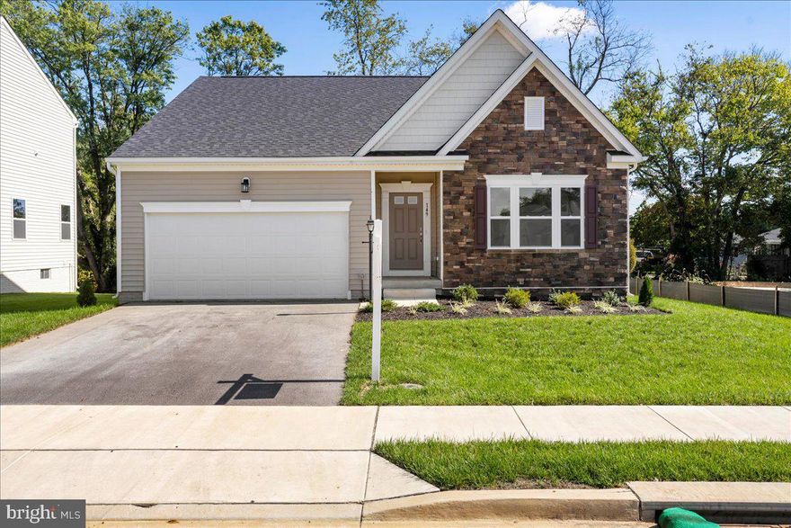 MOVE-IN READY!! Experience the ease of first-floor living in this stunning Avalon home. This home features 3 spacious bedrooms, including a large primary bedroom with a walk-in closet and a deluxe platinum bath complete with a soaking tub and double vanity. The bright kitchen boasts stainless steel appliances, white cabinets, and quartz countertops. Enjoy outdoor living on the 10x20 composite deck with vinyl railings. The finished basement includes a bathroom, adding to the home's versatility. Located in Huntwell West, this home is centrally located near shopping and dining, just 8 minutes from Charles Town, with convenient access to Route 9 and I-81. Photos of a similar model. Call our sales office for a tour today!