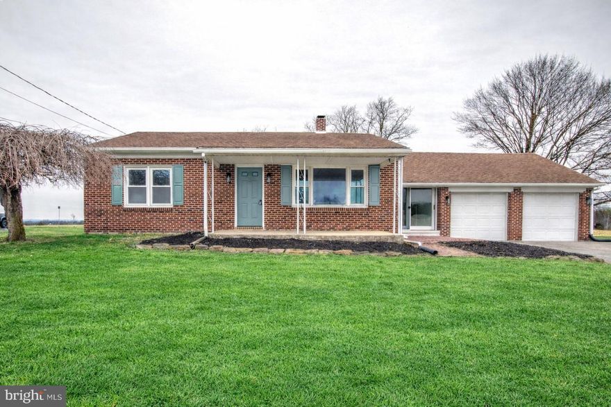Welcome to 7047 Lincoln Highway, a beautifully renovated 3-bedroom, 2-bath brick rancher set on a serene lot overlooking peaceful farmland. This home blends modern updates with comfortable functionality. Step inside to a charming living room with a cozy fireplace and new LVP flooring, flowing seamlessly into the fully updated kitchen featuring sleek white cabinetry, quartz countertops, stainless steel appliances, and a tiled backsplash. The main level offers a stylish hallway bath with a tiled tub/shower, plus three spacious bedrooms, including a primary suite with a walk-in shower and updated fixtures. Double glass doors open to a brick patio and a spacious backyard—perfect for outdoor enjoyment. A convenient 2 car garage serve this home as well. Additional upgrades include recessed lighting, new HVAC, new carpeting and LVP flooring, updated light fixtures, and fresh paint throughout. Don’t miss this move-in-ready gem—contact us today to make it yours! FYI over the range microwave has been installed!