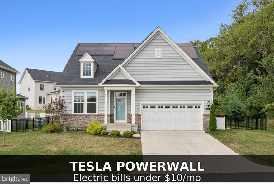 Better Than New | Smart, Sustainable & Stylish

This thoughtfully designed 2023-built home is not only stunning—it's also incredibly energy-efficient. Outfitted with fully paid-off solar panels, a Tesla Powerwall battery backup, and dual EV charging outlets, this smart home is capable of going off-grid with electric bills under $10/month. It's an ideal combination of modern luxury and future-forward sustainability.

Tucked at the end of a quiet cul-de-sac in Woodburn Manor, just across from the brand-new Valley Elementary School, this home features open-concept living with a gourmet kitchen and oversized island, a main-level primary suite with a spa-style bath, and soaring ceilings that fill the space with natural light.

The owner went above and beyond by immaculately finishing the basement, adding a second living area, hidden office, and a full kitchenette—perfect for guests, extended family, or your dream work-from-home setup.

Enjoy a fully fenced backyard siding to trees, offering peace, privacy, and room to play or entertain.

Move-in ready, upgraded beyond builder grade, and filled with thoughtful touches—this home is better than new in every way.