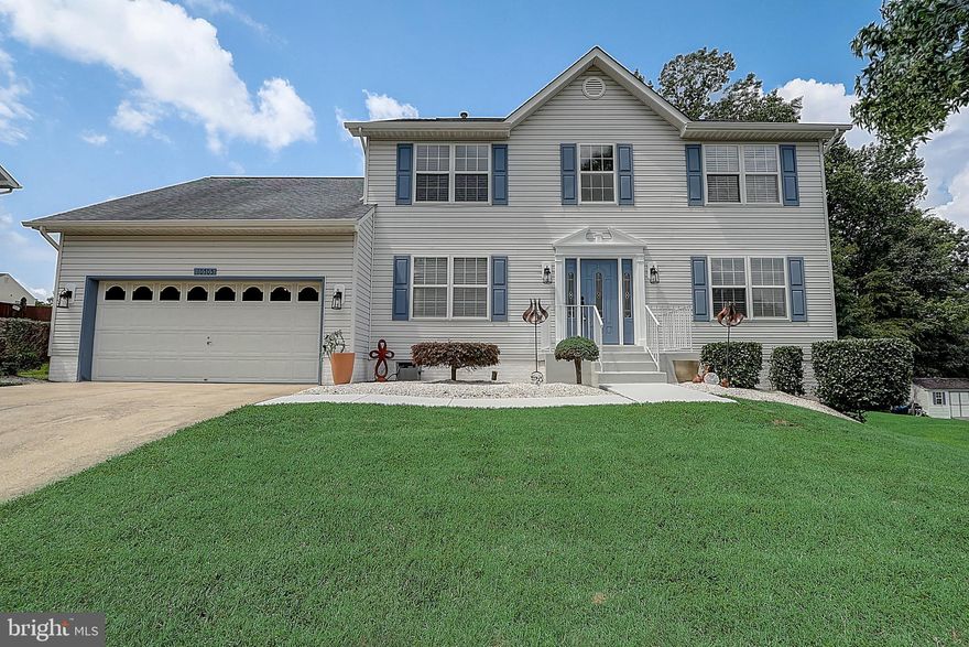 This charming 4-bedroom, 3.5 bath home is absolutely delightful! With over 3000 sq ft of living space, there is plenty of room for comfortable living.  The heart of the home is the kitchen and family room and this kitchen does not disappoint.   The wood floors, updated tiles and fireplace on the main level add warmth and character to the home, while the open concept design and abundance of windows create a bright and inviting atmosphere.  The kitchen, with its granite countertops, and island is a true stunner that will impress any home chef.  The seamless flow into the family/rec room area enhances the overall functionality and convenience.    The family room, with its fireplace and natural light, is a great place to relax and unwind. Entertaining guests? Move the fun down to the  finished lower level with a bar and a recreation room.    Enjoy endless summers and cool autumn nights on the patio or the screened in deck. This is a must see!