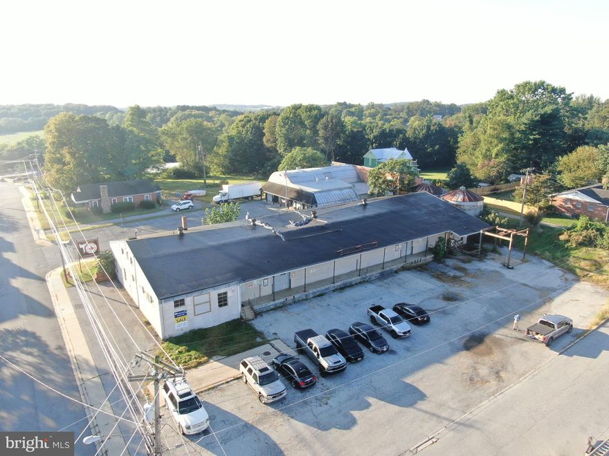 ABSOLUTE AUCTION – PRIME COMMERCIAL REAL ESTATE!
Don’t miss this outstanding opportunity in the heart of Mt. Airy! Ideally located on Center Street, just minutes from I-70, Route 27, and Old National Pike, this property offers excellent accessibility and visibility. Formerly used as a Southern States building, it features a 10,000 sq. ft. structure in need of TLC, and ready for renovation and repurposing. With community commercial zoning, the possibilities are nearly endless. The property also offers ample parking and extensive road frontage along both Center Street and Lookout Avenue.

This property will be offered in a multi-parcel auction, giving buyers the flexibility to purchase Parcel 1, Parcel 2, or both together.

Parcel 1: 101 Center St, Mt. Airy, MD 21771 – .80± acres with a 10,000 sq. ft. commercial building, zoned Community Commercial.
Parcel 2: .58± Acres Center St, Mt. Airy, MD 21771 – 0.58± acres, fenced, with a storage building and parking lot.

This property will be offered at absolute auction on Thursday, October 9, 2025, at 2:00 PM. The List price in no way represents a minimum, starting, or acceptable bid.