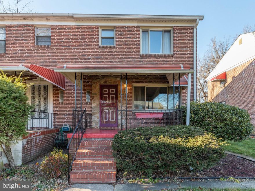 Lovely 3 Bedroom 1.5 Bath Brick and Stone Semi-Detached home.  Well Cared for and Well Maintained.  Wall to Wall Carpeting in the Main Level Living & Dining Rooms.  Entry foyer with Half Bath.  Large Formal Dining Room with Chair Railing.  Carpeted Stair Case leads to the 2nd Level with 3 Bedrooms.  Master Bedroom, 2nd Bedroom has built in Closets and a Computer Study Desk with a Window.  3rd Bedroom has a door leading to a Back Deck/Patio.  Basement has been remolded with Sound Proof Walls and a Custom Built  Bar.  Brand NEW Thomas Creek Windows on all levels of this Charming Home.  Spacious Front Porch with an Awning to Relax and Enjoy this Quiet Street.  Large Level Backyard perfect for Family Fun and Cookouts.  Located blocks for Metro Stations and Bus Lines for easy Commuting.  Convenient to Shopping and Routes 695 & 83.