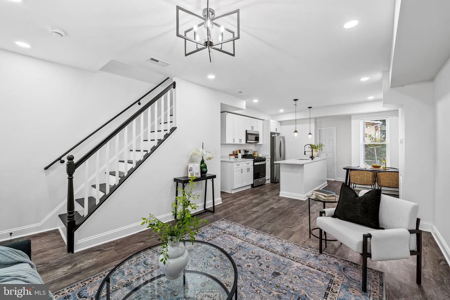 Beautifully renovated 3-bedroom, 1.5-bath townhome offering modern comfort and timeless charm. The updated kitchen features stainless steel appliances and contemporary finishes, opening to a bright living area with an electric fireplace and abundant natural light. Spacious bedrooms and a custom-finished full bath provide style and convenience throughout. The lower level offers great potential to be finished into additional living space. Enjoy relaxing on the inviting front porch or in the fully fenced yard—perfect for outdoor entertaining or pets. Move-in ready and thoughtfully updated inside and out! **Owner will install washer/dryer set OR credit buyer $500 for units of their choosing**