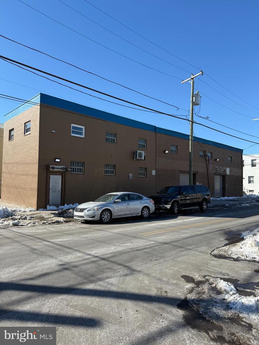 Corner property used as warehouse operation by scrap metal company. Suitable for supply, warehousing, creative retail uses, or development.