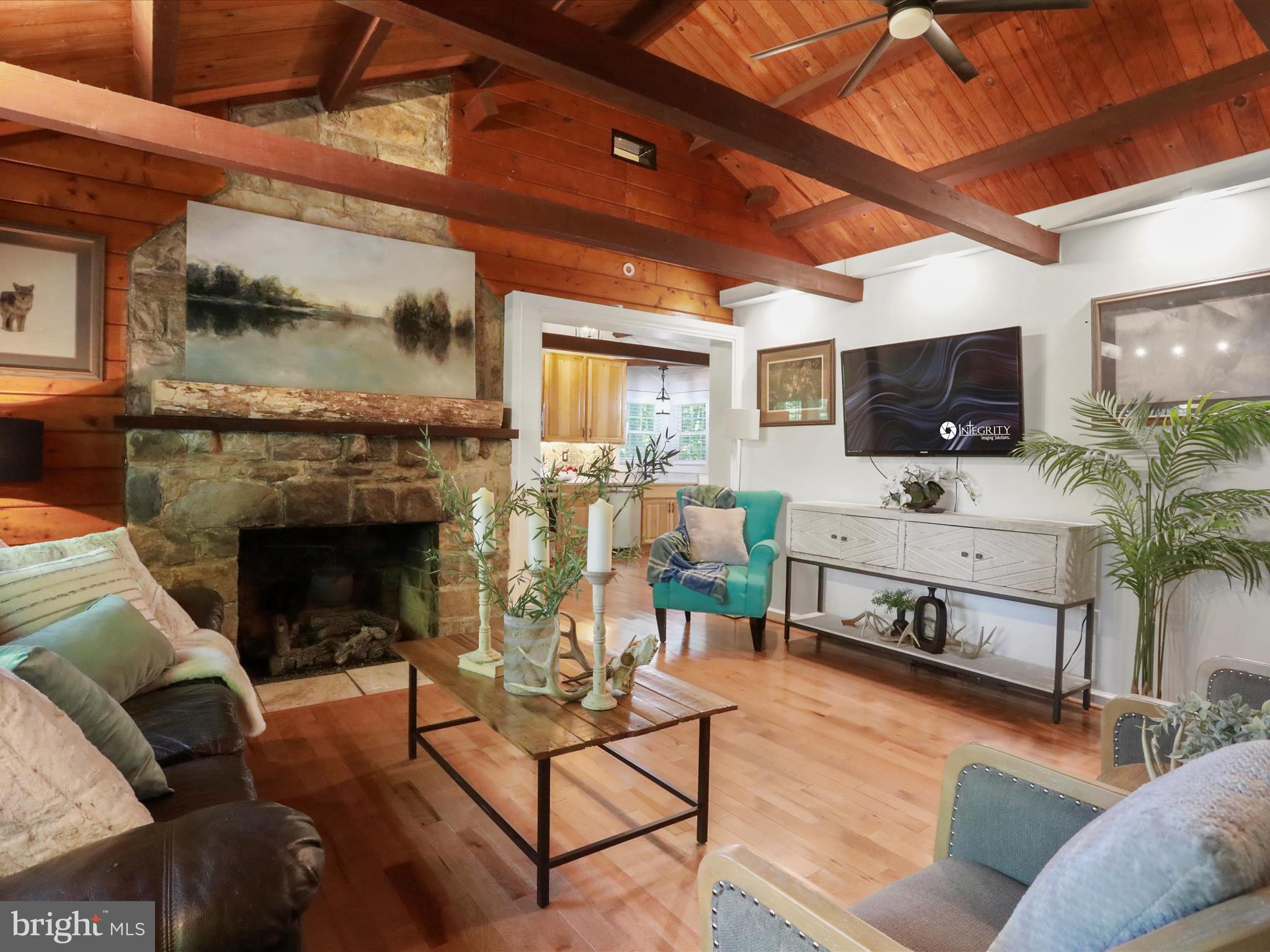 Welcome to this charming ranch-style home that blends comfort, style, and practicality. Step inside to discover a warm and inviting interior featuring two cozy bedrooms, a full bathroom, and gorgeous hardwood flooring throughout. The living area is centered around a brick fireplace, perfect for relaxing evenings or gathering with loved ones. A delightful loft adds extra sleeping space—ideal for guests, kids.
The beautifully updated kitchen is a standout, offering ample cabinet storage, sleek quartz countertops, and a modern layout that will make cooking and entertaining a breeze. Main floor laundry adds everyday convenience, while the unfinished basement—accessible from the outside—offers endless potential for a workshop.
The home sits on a serene 0.34-acre corner lot. The exterior features low-maintenance vinyl siding, a wood shed, perfect for storage or a workshop. The partly wooded lot provides privacy and a natural backdrop of trees, creating a peaceful retreat just outside your door.
Parking is easy with an attached garage and driveway. Conveniently located near the Virginia line, this property is ideal for commuters while also offering close proximity to Mountain Lake and the Potomac River—perfect for outdoor adventures. Whether you're seeking a full-time residence, a weekend getaway, or a potential Airbnb investment, this home offers endless possibilities.
It’s more than just a house—it’s a welcoming haven where nature, comfort, and convenience come together.