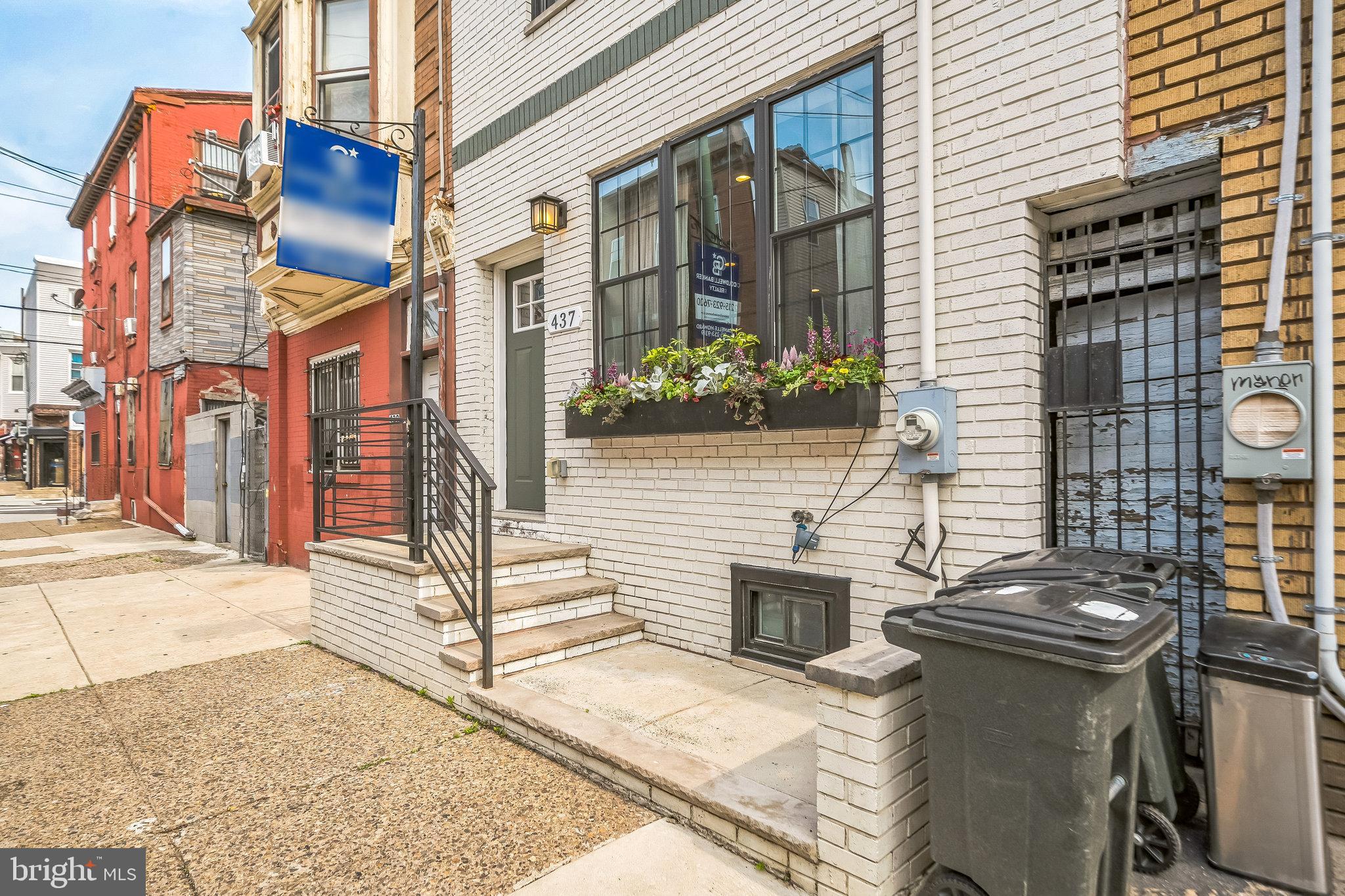 Welcome to 437 Tasker Street, a meticulously renovated 4-bedroom residence that blends timeless character with modern design. Nestled on a desirable 16-foot-wide lot just steps from Dickinson Square Park, this home offers the perfect mix of city living and neighborhood charm. Step inside and be immediately drawn to the warm exposed brick wall and eye-catching floating staircase featuring 3-inch thick oak treads. The open floor plan flows into a chef’s kitchen adorned with rich herringbone hardwood floors, reclaimed wood accents, and a stunning combination of Carrara marble countertops and premium cabinetry. Top-of-the-line appliances complete this culinary haven. Just beyond the kitchen, a thoughtfully designed private backyard oasis awaits, complete with a built-in bench and ample space for entertaining, dining, or relaxing outdoors. Upstairs, the second floor hosts two spacious bedrooms and a full bathroom with custom tile work and a reclaimed dresser vanity, blending rustic beauty with practical functionality. Continue to the third floor to discover the luxurious primary suite, highlighted by a cozy brick accent wall, a generous walk-in closet, and an elegant en-suite bathroom. Enjoy a clawfoot soaking tub, double vanity, and a large glass-enclosed shower, making it the perfect retreat at the end of the day. On the top level, a versatile fourth bedroom awaits, ideal as a guest suite, home office, or entertaining space with direct access to a private front-facing deck. To complete this exceptional home, the fully finished basement includes a separate laundry room and additional space for storage, fitness, or media. Don’t miss this rare opportunity to own a truly one-of-a-kind home in South Philadelphia. Situated between the Pennsport and Dickinson Narrows neighborhoods and just minutes to all your major conveniences, public transportation, dining, shopping, the italian market, east Passyunk, the sports complexes and much more! Schedule your tour today!