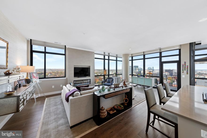 A once-in-a-lifetime opportunity to own the best views from any private residence in Arlington. The premier residence at 2000 Clarendon offers spectacular vistas with floor-to-ceiling windows showcasing unobstructed eastern and northern exposures that frame breathtaking views of the DC monuments to the east and the National Cathedral to the north. Enjoy majestic sunrises and sunsets daily, with sweeping cityscapes and sprawling treetop panoramas from every room. <BR><BR> A RARE AND EXCEPTIONAL CONDO. Built in 2020, this corner unit offers luxury in the clouds with 1,738 square feet, soaring 12-foot ceilings, and a private balcony. The layout features two bedrooms and a flexible den that can serve as a third bedroom. Imagine evenings relaxing with your customizable electric fireplace with city lights twinkling in the background. The owner has invested over $100,000 with a Designer to elevate the space, adding custom wall treatments, shelving, and lighting. The sale includes a large parking space conveniently located across from the elevators, with an additional space available for purchase, and the building’s largest storage unit. Condo fees are notably lower than other premier properties in the area, and include all utilities except electric. <BR><BR> EXCELLENT AMENITIES IN A NEW BUILDING. At 2000 Clarendon, residents enjoy an extensive amenity package, including a two-tier outdoor pool and terrace, a rooftop with panoramic views, a rooftop club room, a fitness center, a package room, and on-site management. As one of Arlington’s newest condo buildings—and with no new developments planned for the next 2-3 years—this is a rare opportunity for those seeking modern luxury in an unbeatable location. <BR><BR> A PREMIER LOCATION WITH 97 WALKSCORE. Easily walk to Whole Foods/Trader Joes, Metro, endless restaurants and bars, specialty fitness classes, shopping, and parks. Stroll across the Key Bridge to Georgetown, across the Memorial Bridge to the Washington Mall, or jog/bike the Mount Vernon Trail with scenic vistas of the Potomac and Washington Monument along the way. Minutes to Reagan National Airport and a short trip to Dulles International Airport, both accessible by Metro. Zip to downtown DC, Old Town Alexandria, Tysons, and more within minutes. There is currently one parking space owned by this unit, but a second parking space has been reserved for purchase through the builder for $45,000 and is optional to the buyer.