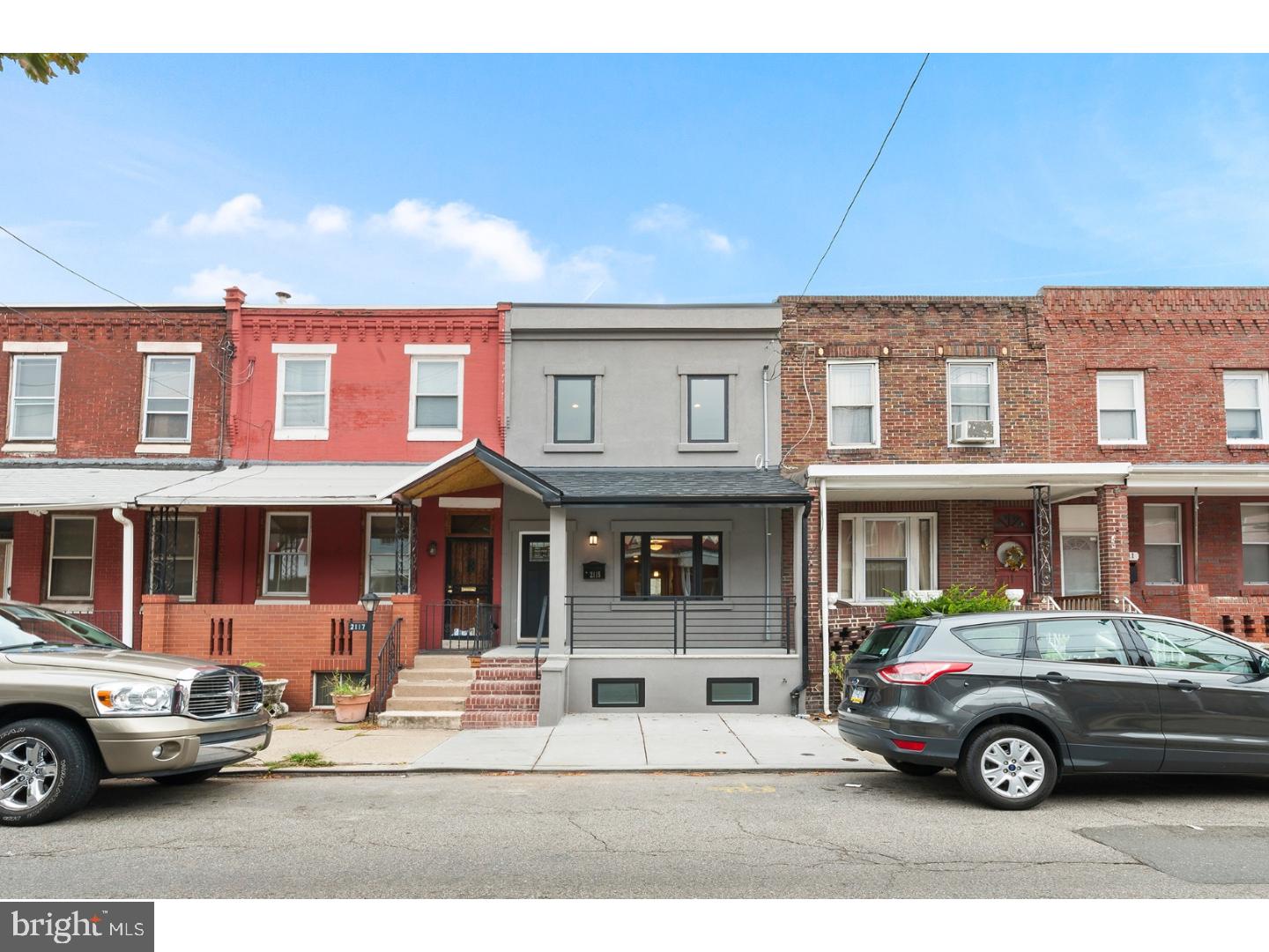 Beautiful porch front rehab in the heart of Point Breeze! This 3 bed, 1.5 bath home is almost 1,200 square feet above ground along with a full finished basement and was meticulously renovated from top to bottom. Andersen windows and wide-plank distressed oak flooring are throughout the home, along with an amazing chef's kitchen with gray kitchen cabinets, stainless steel appliances and Carrara Marble countertops! Walk upstairs to 3 spacious bedrooms, all with closets, built-in night lights in the hallway and a modern bathroom with a stand up shower enclosed in frameless glass. Downstairs is a full finished basement with stylish, polished concrete floors, a half bathroom, and plenty of thoughtful storage space throughout! This home emits tons of natural light. Entertain from the porch, through home to your spacious yard by city standards. 2115 Wharton Street is just steps away from other new construction and close to some of the best amenities Point Breeze has to offer, including, Mattei Family Pizza, Burg;s Hideaway Lounge, On Point Bistro, and the staple, American Sardine Bar. With a "WalkScore" of 94, 2115 Wharton Street is a Walker's Paradise as it is just steps away from Center City and Rittenhouse Square as well as public transportation. Schedule your showing today!