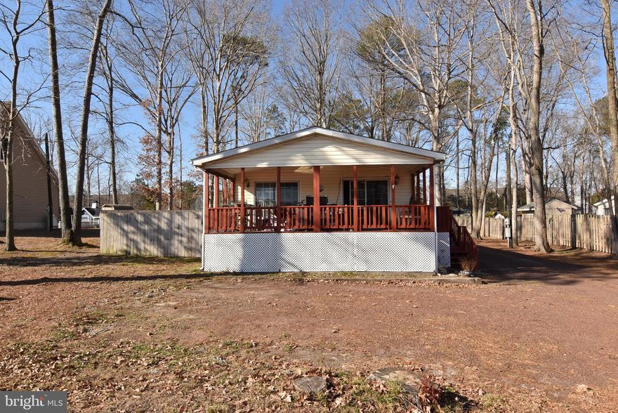 This well-maintained double-wide home offers space, privacy, and peace of mind at an affordable price point. Featuring 3 bedrooms and 2 full baths, the home has been thoughtfully cared for with a 1-year-old architectural shingle roof, a less than one-year-old furnace, and a new water heater. Other updates include newer kitchen refrigerator and dishwasher, LVP flooring added to the kitchen and living areas, and a new walk in shower in the primary bathroom. 

Set on a spacious .57-acre lot, partially fenced for pets and privacy, the property offers ample room for outdoor living. The home is connected to public water, with a separate well for irrigation, and the septic system has passed a Class H inspection.

Ideally located right off the Georgetown–Lewes Bike Trail, providing a scenic ride all the way into Lewes, and just 15 minutes to Route 1 and the Delaware beaches. Enjoy the freedom of NO HOA and NO land lease with Very Low property taxes under $400/year, making this an excellent opportunity for a primary residence or second home. 

Don’t miss this rare combination of land ownership, recent updates, and convenient coastal and recreational access.