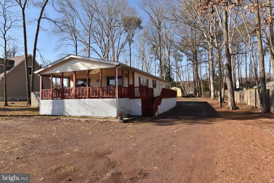 *New Price Plus a $5K credit to the buyers closing costs* Motivated Sellers! This well-maintained manufactured home offers space, privacy, and peace of mind at an affordable price point. Featuring 3 bedrooms and 2 full baths, the home has been thoughtfully cared for with a 1-year-old architectural shingle roof, a less than one-year-old furnace, and a new water heater. Other updates include newer kitchen refrigerator and dishwasher, LVP flooring added to the kitchen and living areas, and a new walk in shower in the primary bathroom. 

Set on a spacious .57-acre lot, partially fenced for pets and privacy, the property offers ample room for outdoor living. The home is connected to public water, with a separate well for irrigation, and the septic system has passed a Class H inspection.

Ideally located right off the Georgetown–Lewes Bike Trail, providing a scenic ride all the way into Lewes, and just 15 minutes to Route 1 and the Delaware beaches. Enjoy the freedom of NO HOA and NO land lease with Very Low property taxes under $400/year, making this an excellent opportunity for a primary residence or second home. 

Don’t miss this rare combination of land ownership, recent updates, and convenient coastal and recreational access.