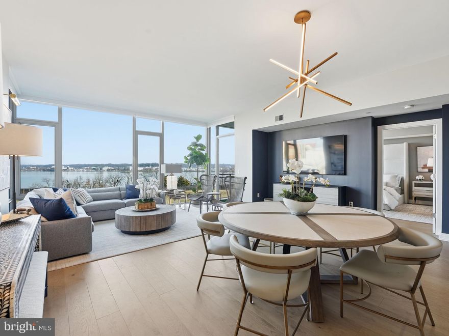 Welcome to Muse Old Town Condominiums, where elevated design meets effortless living in the heart of Old Town Alexandria. This exceptional riverfront residence offers the rare combination of true luxury and low-maintenance condo living, allowing you to enjoy homeownership without the demands—just steps from Old Town’s vibrant waterfront, acclaimed restaurants, charming boutiques, historic streets, and year-round events, with convenient access to Washington, DC and Reagan National Airport (DCA) for an effortless travel lifestyle.

Sweeping Potomac River and Washington, DC views unfold from nearly every room, enhanced by soaring 10-foot ceilings and impeccably curated finishes throughout. The chef’s spacious gourmet kitchen features custom Snaidero cabinetry, Bosch and Thermador appliances, and Waterworks fixtures, blending timeless craftsmanship with modern sophistication. Waterworks bath and kitchen fixtures continue throughout, while the second bathroom offers a Kohler full-size soaking tub, creating a spa-like retreat. Step onto your private balcony overlooking the Potomac, the perfect setting for morning coffee or sunset evenings.

Muse Old Town is a LEED-certified building with a green roof, thoughtfully designed in a modern industrial–chic aesthetic and positioned as part of Old Town’s ongoing redevelopment, including plans for a future city center nearby. The building offers a resort-caliber amenity experience, including three dedicated art studios with classes available, a fitness center, yoga room, rooftop terrace with grilling stations and fire pits, bike lockers, and a dog wash—supporting a vibrant, creative, and connected lifestyle.

The residence conveys two parking spaces, one equipped with an electric vehicle charger, along with a large private storage unit.

An exceptional opportunity to enjoy lock-and-leave luxury living in one of Old Town’s most thoughtfully designed buildings. Seller is willing to convey the residence fully furnished (as seen in photos) for an additional price, to be negotiated separately.