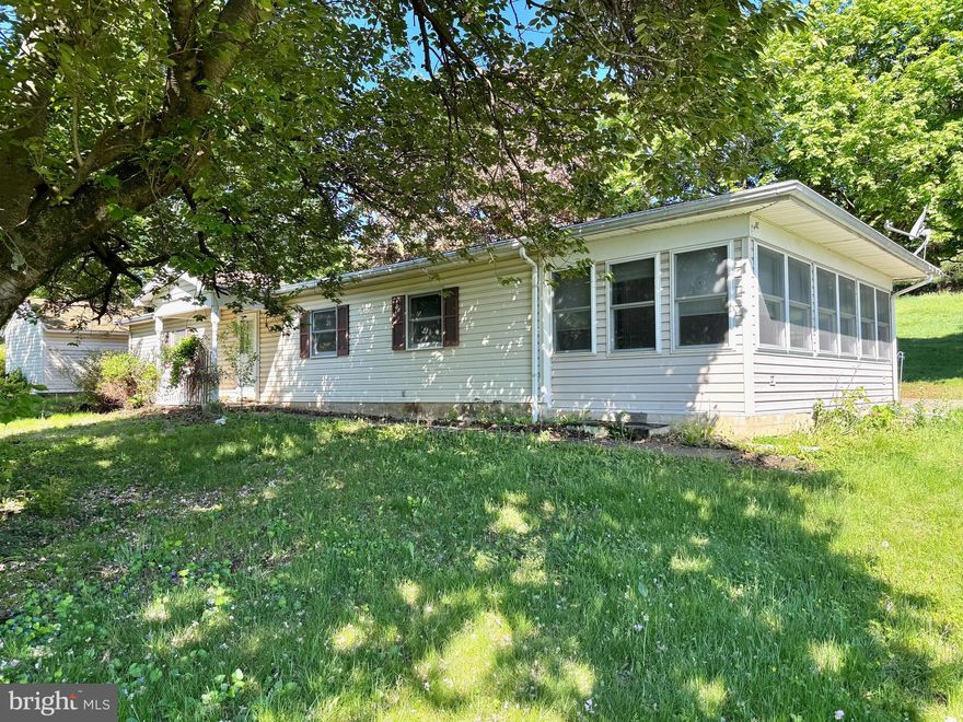 Great opportunity awaits!  Situated on a .61 acre lot, this property has TONS of potential.  As its core, the property was a trailer that over the years had an addition put on and stands as it is today.  It features a Sun Room, Living Room, Dining Room, Kitchen, 2 Bedrooms, 1.5 Baths AND an additional room that could be a Family Room or a 3rd Bedroom.  There is a basement under about half of it (the original trailer.)  The lot is beautiful and backs up to a farm field.  Standard financing will not work for this property since there is no title and due to its age.  Cash Offers preferred!  Motivated Seller.  Estate sale being sold AS-IS.  Please call to schedule your showing today!