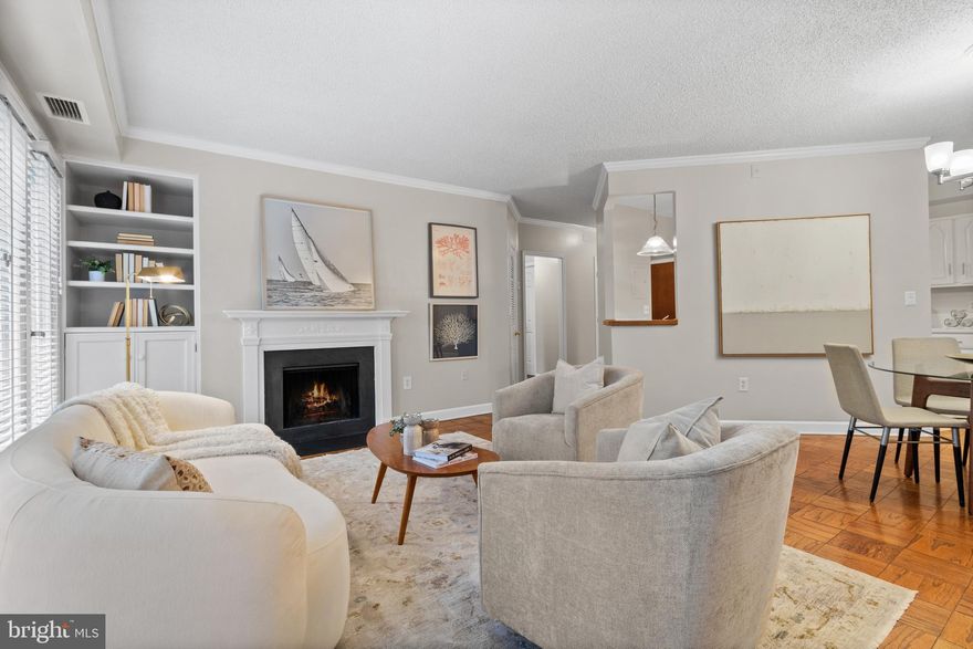 This delightful one-bedroom, one-bath condo with assigned parking offers an inviting living space that's ideal for both relaxation and entertaining, with the perfect balance of comfort and convenience. 

Discover a warm and welcoming living area, highlighted by a cozy wood-burning fireplace that serves as the focal point of the room. 
French doors gracefully open onto your private balcony, which provides an excellent space for sipping your morning coffee .

The primary bedroom  features a spacious walk-in closet, and additional closet ensuring ample storage and organization. 

The condo's amenities extend beyond its walls to include a sparkling outdoor pool, perfect for cooling off on hot summer days or lounging under the sun. For those who enjoy grilling and socializing, the dedicated barbeque area offers a fantastic venue for hosting gatherings with friends and family.

Convenience is key with this condo's prime location in the Southeast quadrant. Situated within walking distance to a variety of shops, restaurants, and grocery stores, you'll have everything you need just steps away from your front door. 

Just  a short distance from Reagan National Airport and Washington, DC., this strategic location makes it easy to reach your destination or explore the vibrant cultural and historical landmarks of the nation's capital.