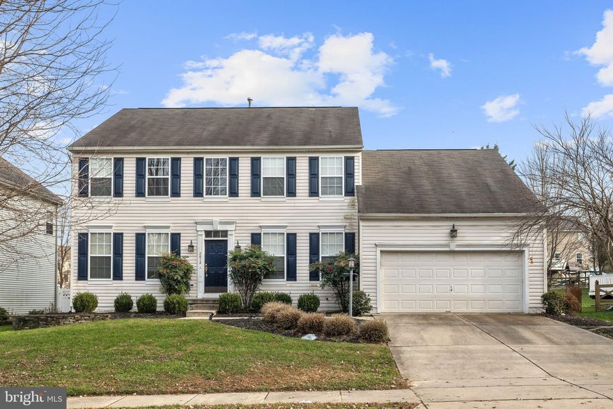 Beautiful Colonial located in the coveted Daniels Mill Overlook of Ellicott City.  A soaring two story foyer, architectural columns and a soothing neutral color palette welcome you to this bright and airy home.  Mirrored formal living and dining rooms boast crown molding, a decorative ceiling medallion and gleaming hardwood floors.  The sunbathed kitchen features ceramic tile flooring and backsplash, 42 inch light wood cabinets, stainless steel appliances, Corian counters and a kitchen island with breakfast bar and adjacent breakfast room that offers access to the expansive deck.  Off of the kitchen is the gracious family room highlighting a wood burning fireplace in a stunning pale marble setting.  Spacious master suite hosting a large walk in closet and luxury en suite bath featuring a soaking tub, dual vanity, and glass enclosed shower.  Fantastic lower level offers a recreation room, game room, 2 bonus rooms and full bath!!  The fenced back yard with its landscaped grounds and custom brick patio provide the best in outdoor living.  Two car garage.  Updates include: Brand new A/C, interior paint, and more!