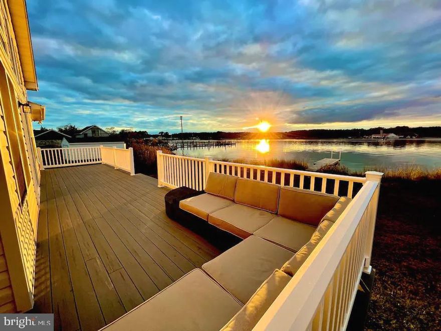 Stunning Madison Bay sunsets, and that’s not all!!  This lovely custom contemporary home greets you with a bright and spacious open floor plan, with the amazement and beauty of an entire wall of floor to ceiling windows as you enter …. It’s spectacular! The cathedral ceilings and gas fireplace add warmth and charm to the large great room; and the sliding glass doors leading out to the rambling deck provide seamless indoor-outdoor living. The kitchen overlooking the family room is a fantastic feature, allowing the chef to be included with family & guest conversations. Having a separate wing with two bedrooms and a full bath allows the primary bedroom suite to be its own peaceful retreat with a private waterfront deck, walk-in closet, and luxurious bathroom complete with a soaking tub, separate shower and double vanities. Situated on approx.. .92/-+ ac (almost an acre) it also has an attached oversized two-car garage which adds convenience and practicality, and the inclusion of public sewer is a definite plus. There is a recently installed 130’ pier plus 10 foot platform = 140 total  with electric and an additional floating dock -offering the opportunity for fun water activities and easy access to the bay.  Water depth is approx.  2.5 MLW +/-  Other notables to mention…. the home has been freshly painted, recent granite counters and a brand-new heat pump has been installed. Overall, this is a truly special property, offering both freshness and functionality in a breathtaking waterfront setting. Showings are currently available on most Sundays after 11am - and most Mondays  through Thursdays, at this time. Sorry for any inconvenience.