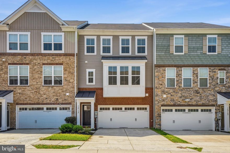 Welcome to this beautiful three-level home in the sought-after Riverwalk community, offering an open-concept layout perfect for modern living.  The townhome is in the original “Annapolis” build, the largest build in the Riverwalk community, with an impressive 2,544 sq. ft.  It offers plenty of natural light with double-paned, energy-efficient windows throughout.  The main floor features wall-to-wall hardwood floors.  The extended bump-out leads to the massive, modern kitchen with a 15-foot, palatial center island perfect for entertaining.  The kitchen features granite countertops, stainless steel appliances, including a gas range/oven and microwave range hood, floor-to-ceiling cabinets, a large pantry, and an inset nook perfect for a wine or coffee bar.   The adjacent dining room offers picture windows.  On the other end, the family room is warm and inviting, pre-wired for internet and a home entertainment center, and leads to the second-floor balcony/rear deck through a sliding glass door. A convenient half bath is tucked away from the living area.  Double pantries and cabinets galore provide an oasis of contemporary living.  Go down one level via the spacious stairway to a family room/spacious office, which provides access to the backyard through a sliding glass door.  The backyard is enclosed with a gated, tall white vinyl privacy fence with New England pot tops.  The enclosed, beautifully landscaped backyard has a spacious elevated deck (made with TimberTech® Decking) perfect for lounging, entertaining, and barbeques.  The lower level features a half-bath with pedestal sink and a hardwood entryway which leads to the cavernous 2-car garage with shelving and ample storage space.  The third level consists of a primary bedroom with a large primary bath, featuring a newly installed BathFitters® shower remodel with exquisite glass doors.  The BathFitters® shower includes a lifetime warranty that passes to subsequent owners.  The primary bath also features double sink vanities, a huge walk-in shower and private enclosed toilet area. The primary bedroom is spacious, able to accommodate a king-size bed, and leads into a walk-in closet capable of accommodating ample storage.  The two additional bedrooms are serviced by an equally well-appointed hall bath and a full-sized washer and dryer (both included, if desired).  The laundry room is contiguous to the hall bath. The hall bath also features a newly renovated BathFitters® shower/bath combination, which comes with a lifetime warranty.  The two front bedrooms have windows that flood the bedroom area with a lot of natural light. There is ample storage, to include extra storage in the stairwell area. The entire home has a fire sprinkler system.  The community backs to serene green space and a conservation area, offering a peaceful natural setting.  It also offers numerous playgrounds and common spaces, ideal for children and socializing.  It is conveniently located a short distance from restaurants, coffee shops, movie theatre, and banks, with easy access to major commuter routes.  It is located within the  Crofton school district.  Mortgage savings may be available for buyers of this listing.  All in all, an amazing place to call home.