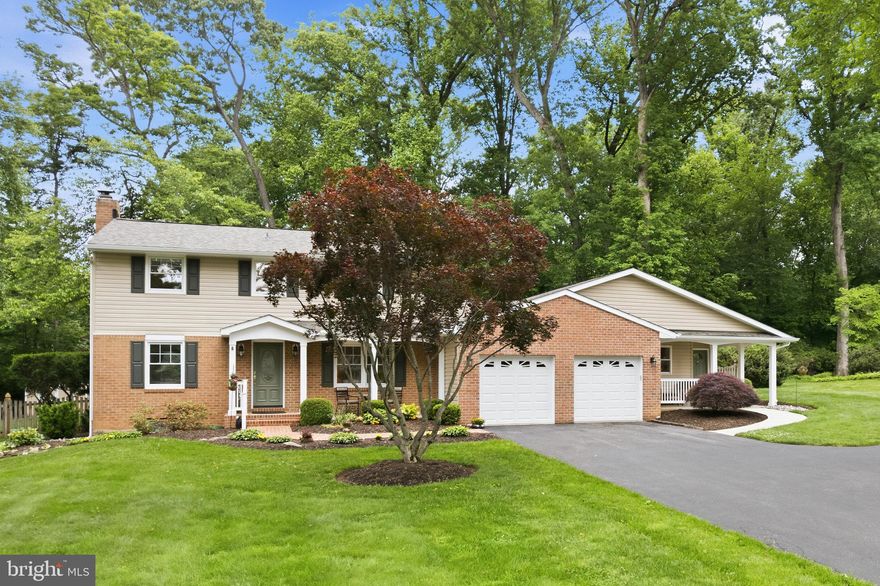 This charming colonial home, nestled in the desirable Beaverbrook community on a gorgeous half-acre wooded lot, offers a perfect blend of comfort and modern living. With three finished levels, five spacious bedrooms, three and a half updated ceramic bathrooms, renovated kitchens, beautiful hardwood floors throughout, and a separate 1,100 square foot apartment that could be utilized for multi-generational living or rental income, this residence is designed for both relaxation and entertaining. The apartment features its own kitchenette with Corian countertops, formal living and dining rooms with vaulted ceilings and private patio and back yard access, and a large bedroom ensuite with a full ceramic bath and a walk-in closet. The heart of the home features a traditional floor plan with formal dining and living rooms adorned with a cozy fireplace. The kitchen is fully equipped with Zodiac quartz countertops, pantry closet, stainless steel appliances, including a self-cleaning oven, built-in microwave, and a gas cooktop as well. Enjoy meals in the bright breakfast area which provides access to the attached deck and gorgeous, serene, level, partly wooded fenced rear yard with a shed, great for a garden, an active household, and pets. The upper level features the primary suite, three additional bedrooms, and another full ceramic bath. The basement is partially finished with a recreation room, a den or office, walk-up stairs, and space to customize future living needs. Thoughtfully located are main level and basement laundry rooms. Ample driveway parking and the attached oversized garage with electric vehicle charging stations, add to the convenience of this home. The architectural roof, vinyl siding, gutters, gutter guards, and second floor bathrooms were replaced in 2025. The home is served by natural gas, public water, and sewer. Located in a suburban setting, enjoy the tranquility of tree-lined views while being walkable to Centennial Park and Wilde Lake, and just a short drive to a variety of local shops, restaurants, and amenities including basketball courts, a community pool, bike and walking trails, and access to Howard County Schools. The home is not subject to mandatory Columbia Association dues. Come visit the Open Houses on 5/30 and 5/31 from 1-3 PM.
