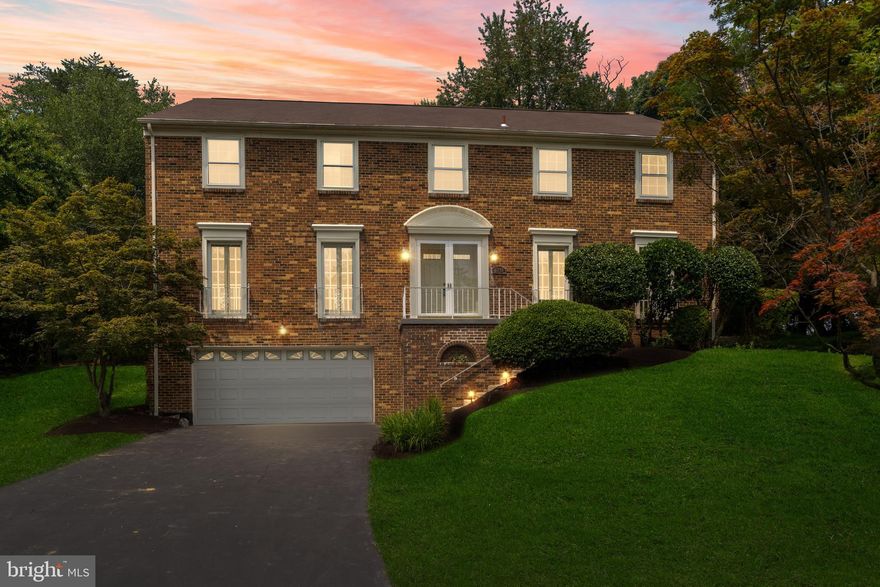 This stately colonial home, located in the Pine Knolls neighborhood in Potomac, is a true gem with its picturesque setting and spacious living space. Built in 1979 by the renowned builder C.I. Mitchell, the Cedar Hill Model is a testament to quality craftsmanship.
As you approach the home on the quiet cul-de-sac, you'll immediately be drawn in by its charm and inviting presence. The property sits on a generous 1/3 of an acre lot, back to wooded area.
Spanning three levels, the house boasts over 5,000 square feet of living space, offering plenty of room for a comfortable lifestyle. With a total of 5 bedrooms and 4.5 bathrooms, there's ample space for a large family or guests.
The main level of the house features an office with wood paneling, making it an ideal space for those who work from home. Additionally, there's a convenient powder room on this level. The large family room with a stone fireplace opens up to the backyard slate stone patio, creating a perfect blend of indoor and outdoor living.
The formal living room and dining room have been upgraded with crown moldings and chair railings, adding an elegant touch to the space. The kitchen has been newly renovated. The adjacent breakfast area features a beautiful Tiffany lamp, seamlessly combining old-world charm with modern amenities to create a delightful ambiance for cooking and dining. 
Moving to the upper level, you'll find five well-appointed bedrooms, three full bathrooms, and a conveniently located laundry room. The primary bedroom suite is connected to a bedroom that could serve as a nursery, dressing room, or additional home office. The master bathroom features an elegant step-up design, complete with a large double vanity and an oversized recessed soaking tub with a shower. The three additional bedrooms on this level are spacious, and two more full bathrooms complete the floor plan.
The lower level of the home is fully finished and offers versatile spaces for recreation, play, games, exercise, or relaxation. It includes a built-in electrical fireplace, a trendy full bathroom and a modern wet bar, making it an excellent option for an in-law suite or accommodating multi-generational living. There are plenty storage spaces on this level. A separate entrance next to the garage enhances the privacy and convenience of this property. The walls and floors of the oversized two-car garage can easily park 4 sports cars. It just have been freshly painted to give it a new look. 
For nature enthusiasts and active residents, the property backs to green space and offers access to a path leading to the nearby Potomac Community Center, tennis courts, and Falls Road Golf Course, providing endless opportunities for family fun and outdoor activities.
The location is ideal, being only minutes away from Potomac Village, Cabin John Shopping Center, Montgomery Mall, Great Falls National Park and the interstate corridor, offering easy access to various amenities and transportation.
In summary, this sophisticated and high-quality home is sure to delight discerning buyers seeking a spacious, comfortable, and well-appointed living space in the heart of Potomac's desirable Pine Knolls neighborhood. For more information on Pine Knolls, please go to "Neighborhood Scout" website and search for Pine Knolls in Potomac, MD.