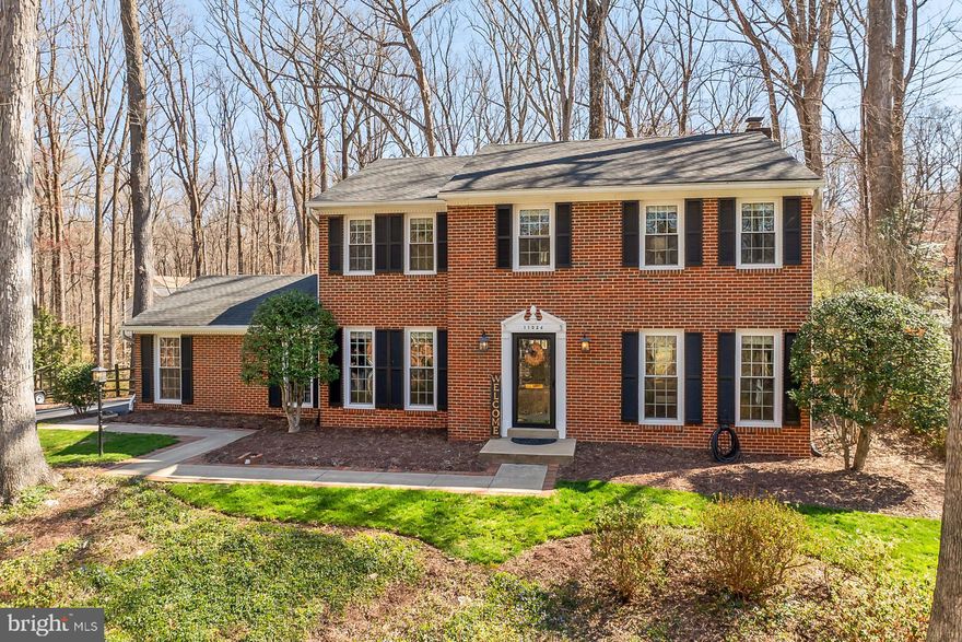 Welcome to this charming brick front colonial home, nestled on a private lot with more than 3,000 square feet of living space.  A lovely hardscaped walkway leads you to the front door where you are greeted by warm oak floors that sprawl throughout the main level.  A spacious dining room is conveniently located next to the gourmet kitchen with plenty of dark wood cabinetry and granite countertops, providing plenty of space for all your needs.  Enjoy an informal breakfast in the bay window nook, or cozy up by the whitewashed brick fireplace in the adjoining family room; here you are granted access to the lovely fenced yard beyond surrounded by majestic mature trees.  Back inside, a formal living room with tons of natural light, a laundry center, powder room and 2 car side load garage complete the first level.  Upstairs you will find 3 secondary bedrooms, each with generous closet space and hardwoods that share the beautifully renovated hallway bathroom.  The massive primary suite features multiple closets and an updated spa-like en-suite bathroom.   The lower level provides plenty of versatile space for entertainment or relaxation with plush new carpeting.  A third updated full bathroom and bonus room (currently being used as a guest room) completes this level of the home.  If you're looking for convenience and privacy, you've found it here.  Welcome Home!
Easy access to the Fairfax County Parkway, Route 123/Ox Road, commuter bus stop at entrance of the neighborhood, Burke Center VRE station minutes away. Robinson Secondary and Oak View Elementary schools, Community pool with memberships available, tennis courts, neighborhood pond, and walking trails.
Roof - 2016,  Windows - 2016,  HVAC - 2016,  Hot water heater – 2016,  New carpet in basement - 2024.