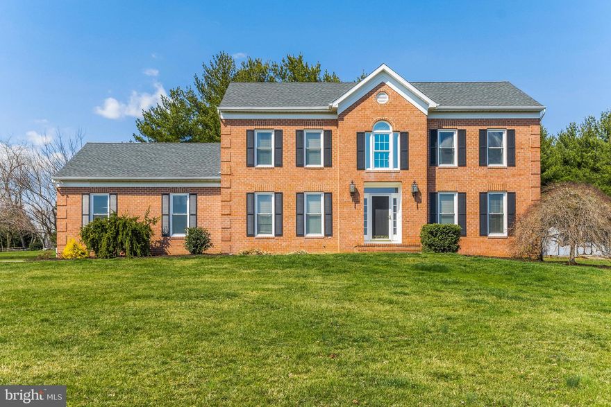 Welcome home!  This beautiful brick front colonial is perched on top of a corner lot offering great views of the community.  This home boast over 3,500 sq ft of living space, has a two car garage and sits on just over 1 acre.  Including 5 bedrooms, 2 full bathrooms and 2 half baths.  Amenities on the first floor include upgraded hardwood flooring throughout,  an updated eat in kitchen with white cabinets with stainless steel appliances and granite counters, a family room with a wood burning fireplace, a main floor office, a huge main floor half bath, formal dining room and mud/laundry room  Not to mention, there is screened in porch with vaulted ceilings, composite decking, sky slights and ceiling fan. 
 On the upper level you will find all new carpet throughout, four generous sized bedrooms, an updated hall bath and a gorgeous master suite.  The master suite includes a large bedroom, a custom walk in closet and a dreamy bathroom.  The master bathroom has heated tile flooring, a heated towel rack, a double vanity and a shower for two!  The shower has frameless glass, a doorless entry,  3 shower heads and built ins for shower products.  This bathrooms is AMAZING!!
The lower level is fully finished  with a large rec room, a half bath that could be upgraded to a full bath, a 5th bedroom, a wet bar with granite countertop and utility room.  Brand new carpet was just installed in lower level also.
The one acre lot offers plenty of space to move around and also includes a small Koi pond,  a shed, and a paver patio with built in fire pit leads you to the enclosed patio.
Nearly all the major components of the home have been replaced.  Ask for a copy of our spec sheet. 
This place is pretty amazing!  Don't miss out on this one!!