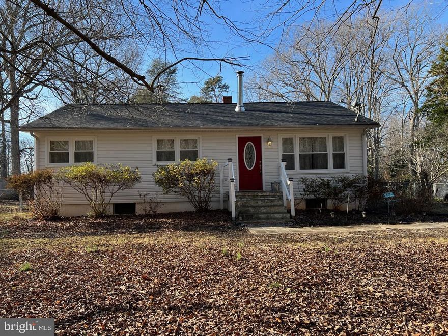 Country living! Updated granite/stainless steel,ceramic tile kitchen! Hardwood floors. 2 1/3 acres with no HOA and plenty of side parking for RV, boat, trailer or whatever.  Kitchen/breakfast opens to small deck, walks down to back yard or stairs to roomy unfinished basement. Includes washer, dryer and freezer in basement.