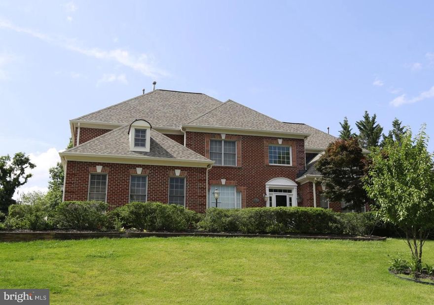 Stunning four sides brick colonial home with 3 cars side-loading garage in a great location across from Woodley Mill.  **Main Level owner's suite with master bath** Dramatic 2-story Foyer, Great Room/Family Room with gas fireplace and wall of windows**Spacious library with coffered ceiling** New carpet in all the bedrooms.  9” Ceiling height in 1st level and lower level.   Lower level with walk-out access and full bath.   Great location near major transportation, minutes to the Silver Line metro, Tysons and McLean shopping & retail, 495, I-66, and Route 267 (Dulles Toll Road for convenient access to Dulles Airport). Walk to Springhill Recreation Center with pool, gym, and Racquetball.   It feeds into Springhill Elementary, Cooper Middle, and Langley High School pyramid.