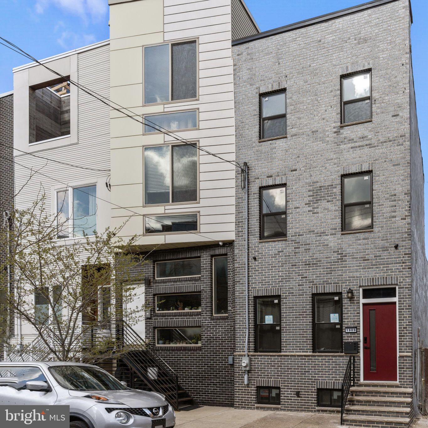 Fully renovated 4-bedroom, 2.5-bath home located on one of the widest and most parking-friendly blocks near the heart of Fishtown. Surrounded by renovated and new construction properties, this home features a modern design, thoughtful upgrades, and smart technology throughout.....Front exterior boasts updated black brickwork and natural stone steps, leading into a bright, open-concept main floor with soaring ceilings in the living room, a spacious dining area, and a stunning galley-style gourmet kitchen. The kitchen is equipped with soft-close shaker cabinets (white uppers, royal blue lowers), Calacatta Gold quartz countertops, LG ThinQ stainless steel smart appliances, a custom stainless steel hood, farmhouse sink, wine rack, and brushed gold hardware...... Powder room is conveniently located on the main level. Step out from the kitchen through sliding doors into a private, fully fenced backyard with newly poured concrete—ideal for entertaining or relaxing outdoors. .......The second floor offers three generously sized bedrooms, a shared full bathroom with custom double vanity, and a dedicated laundry room with full-size LG stackable washer and dryer.......Spacious third floor is the luxurious primary suite, complete with large windows, an oversized walk-in closet (his & hers), and a hotel-style bathroom featuring a soaking tub, frameless glass shower, double vanity, and designer tile. )......Additional features include: Wide-plank luxury vinyl flooring throughout, Custom tilework in all bathrooms, recessed lighting, premium Sherwin-Williams Emerald paint, two-zone high-efficiency HVAC and smart home tech including electronic door locks, cameras, LG smart appliances......Fully finished basement with tile flooring—ideal for a rec room, gym, office, or storage.......Located just a short walk from top dining, shopping, and entertainment options including Mulherin’s, Loco Pez, La Colombe, Kalaya, Suraya, Frankford Hall, and more. Quick access to SEPTA’s Market-Frankford Line, I-95, Center City, and the airport.